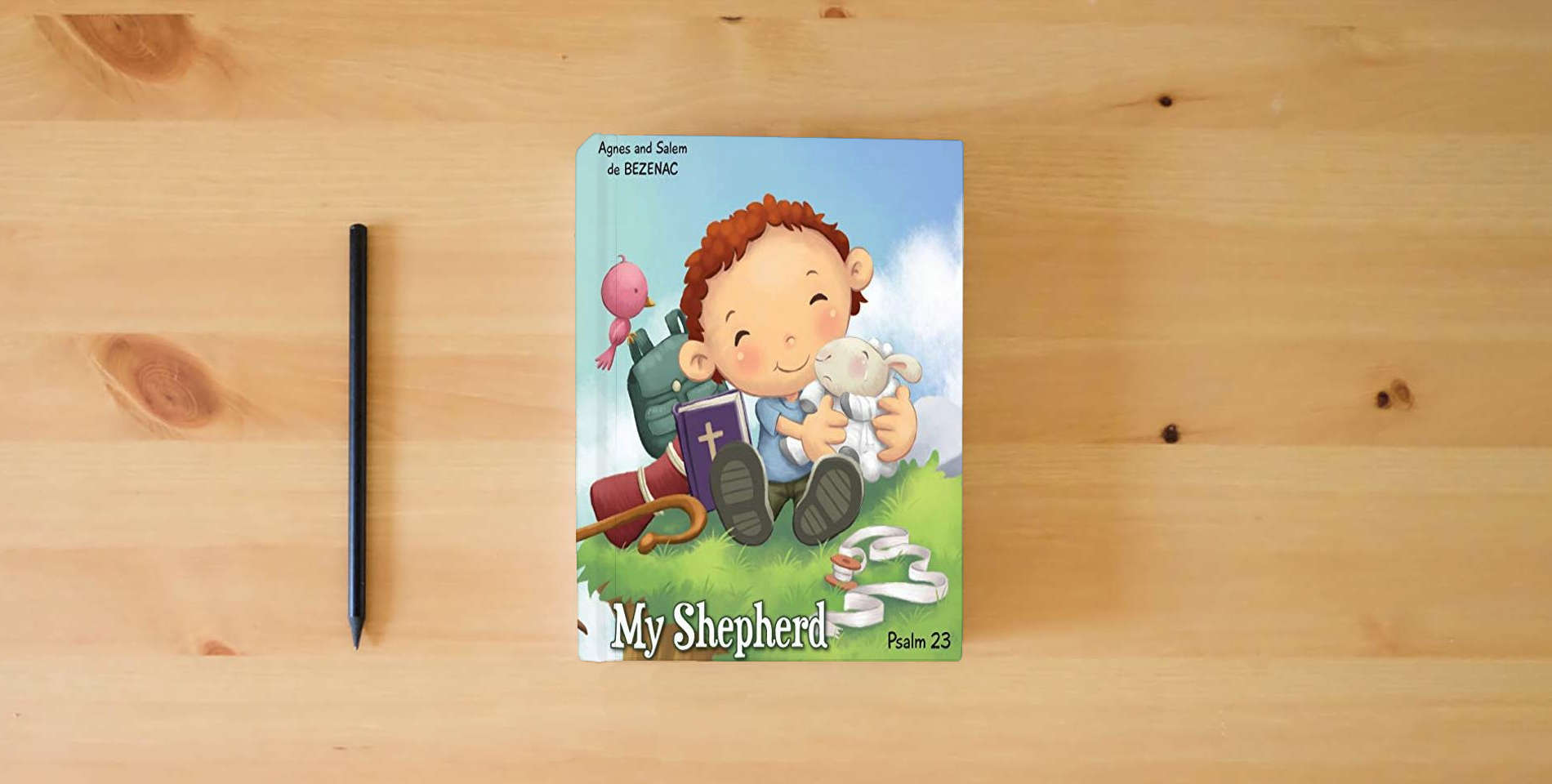 The book My Shepherd: Psalm 23 (Bible Chapters for Kids) is on the table