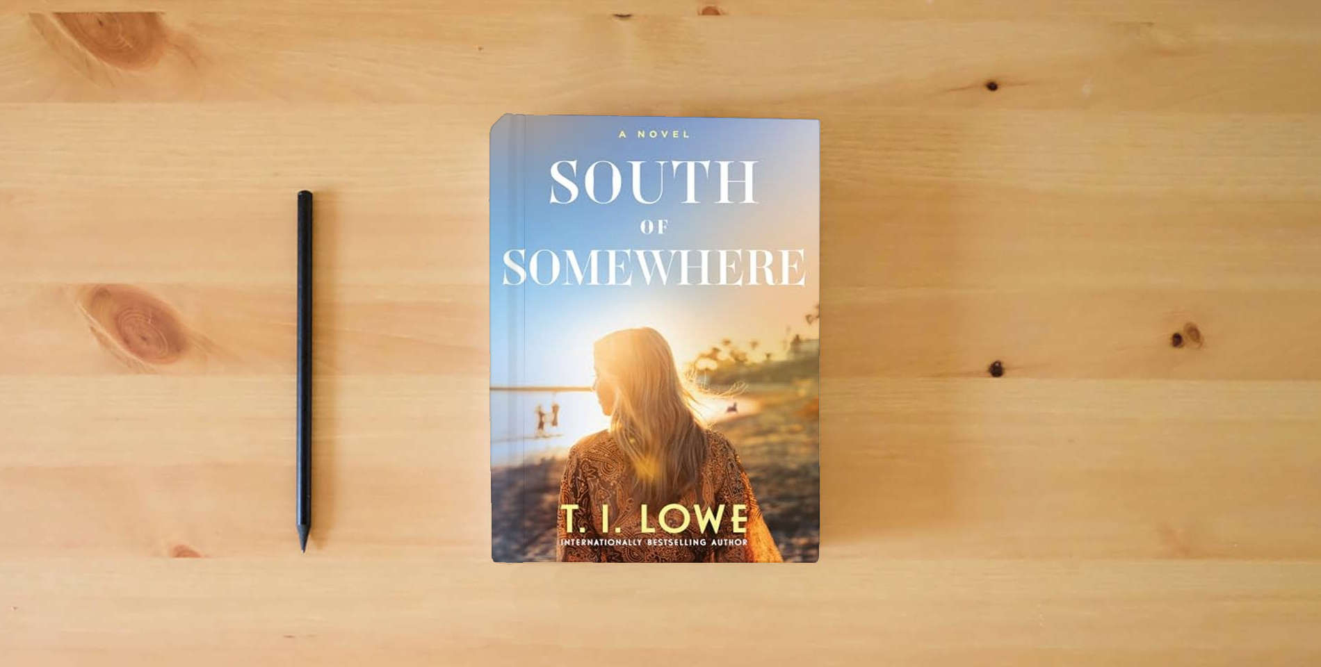 The book South of Somewhere is on the table