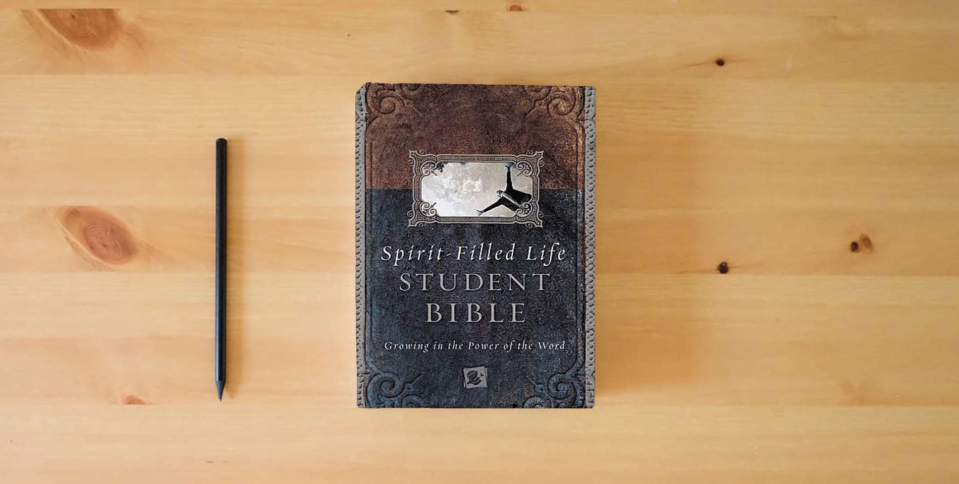 The book Spirit-filled Life Bible For Students Growing In The Power Of The Word is on the table