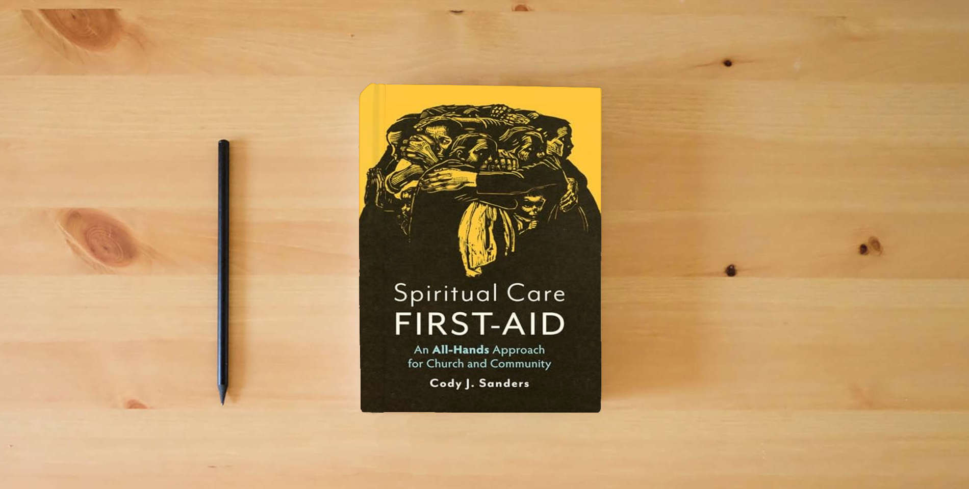 The book Spiritual Care First-Aid: An All-Hands Approach for Church and Community is on the table