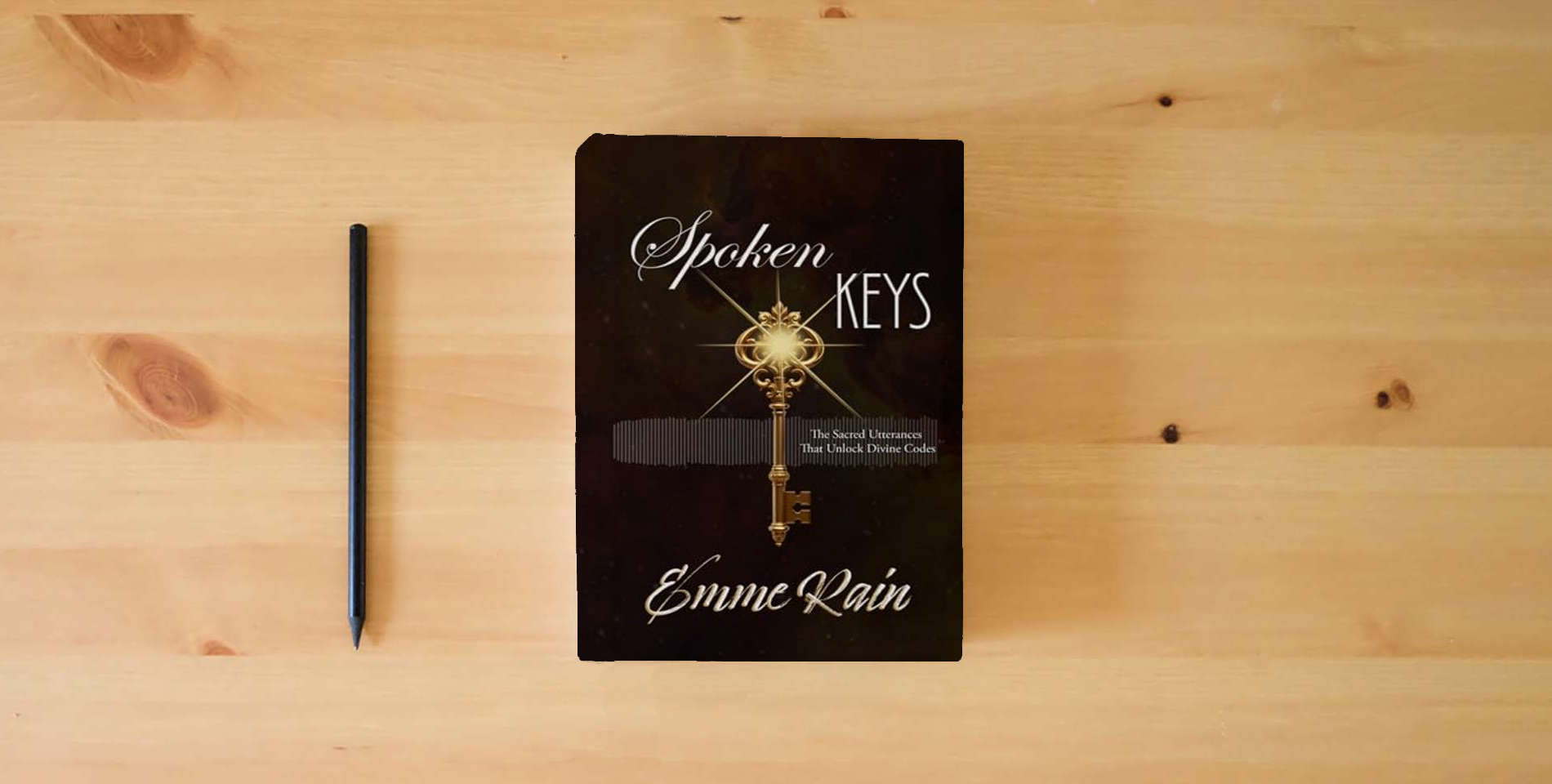 The book Spoken Keys: The Sacred Utterances That Unlock Divine Codes is on the table