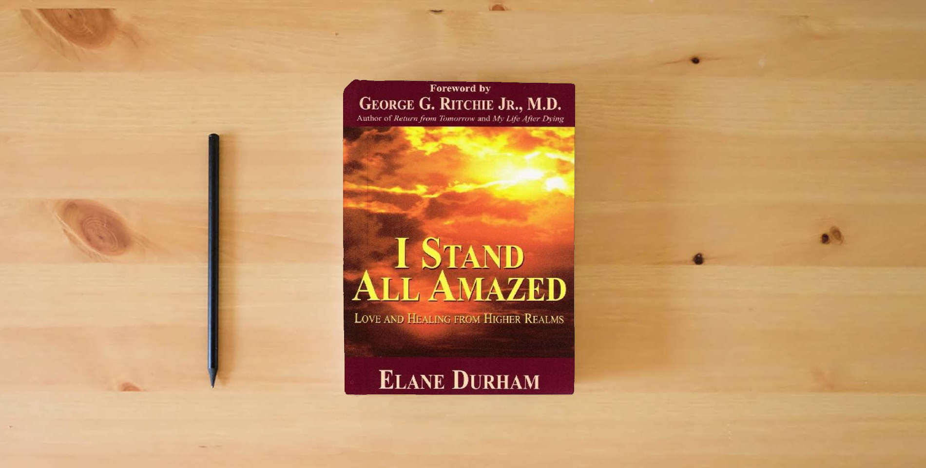 The book I Stand All Amazed: Love and Healing from Higher Realms is on the table