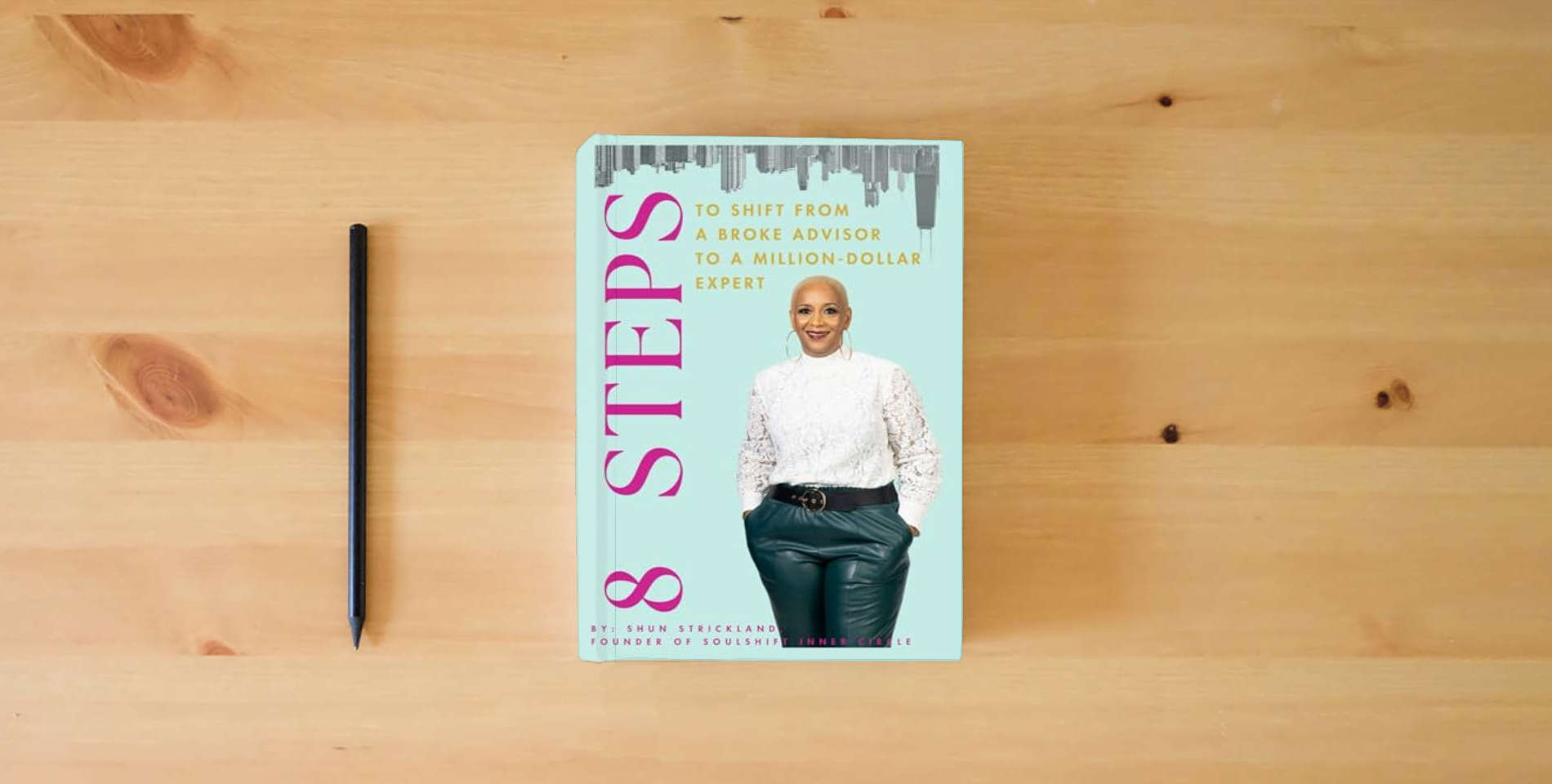 The book 8 Steps To Shift From Broke Advisor to Million Dollar Expert is on the table
