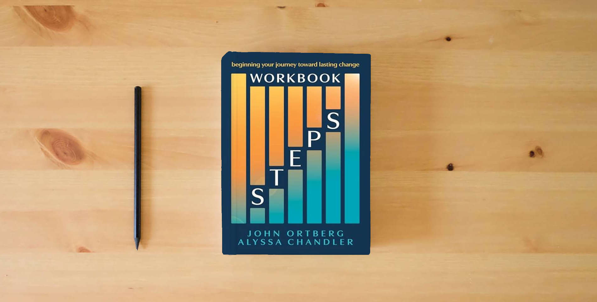 The book Steps Workbook: Beginning Your Journey toward Lasting Change is on the table