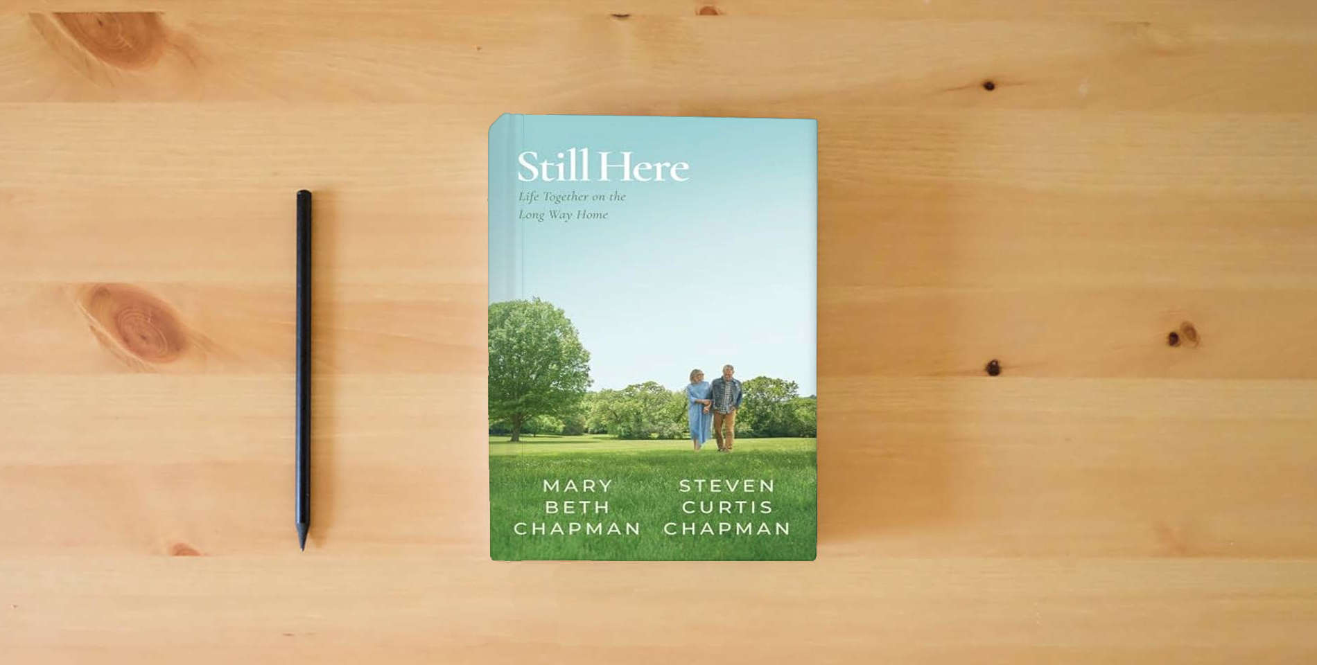 The book Still Here: Life Together on the Long Way Home is on the table