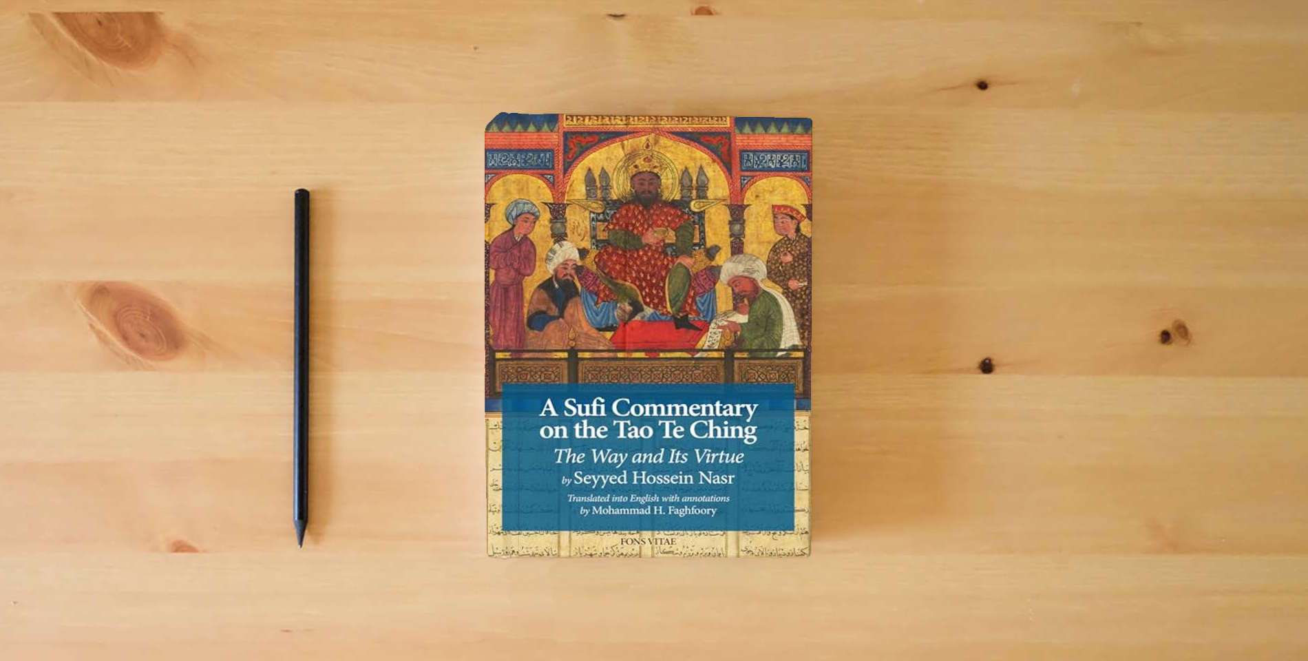 The book A Sufi Commentary on the Tao Te Ching: The Way and Its Virtue is on the table