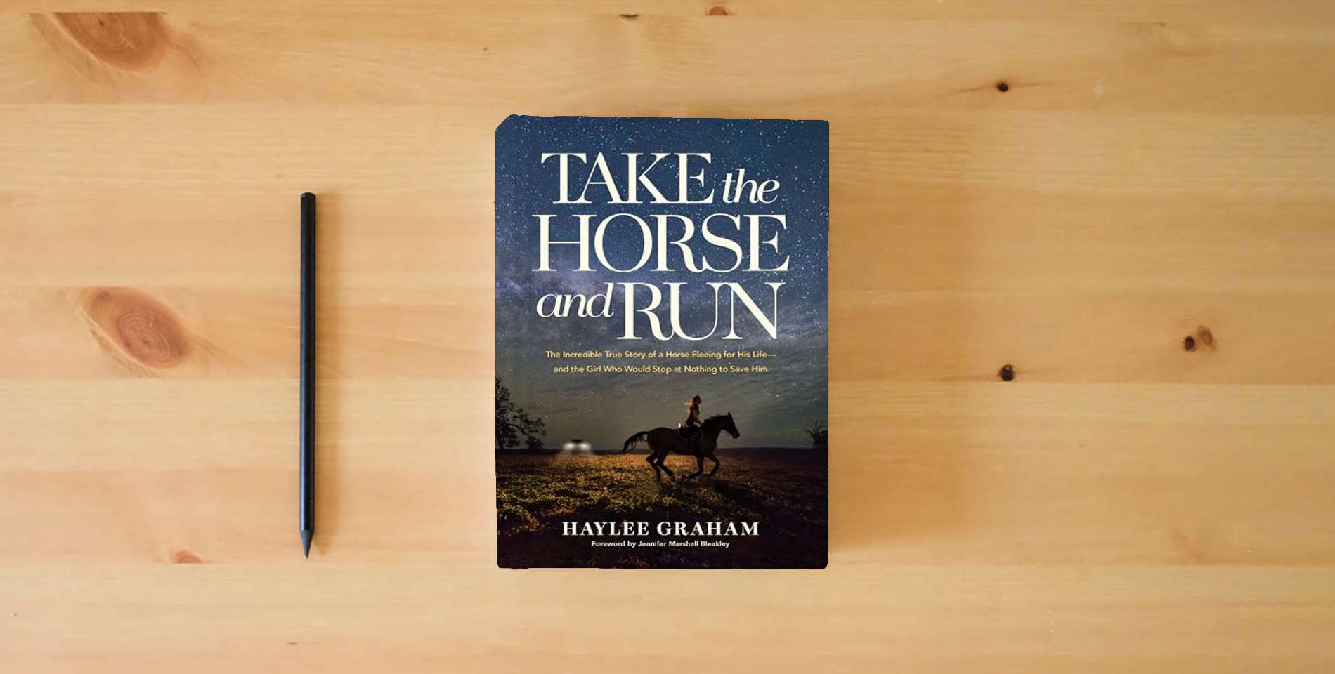 The book Take the Horse and Run: The Incredible True Story of a Horse Fleeing for His Life--and the Girl Who Would Stop at Nothing to Save Him is on the table