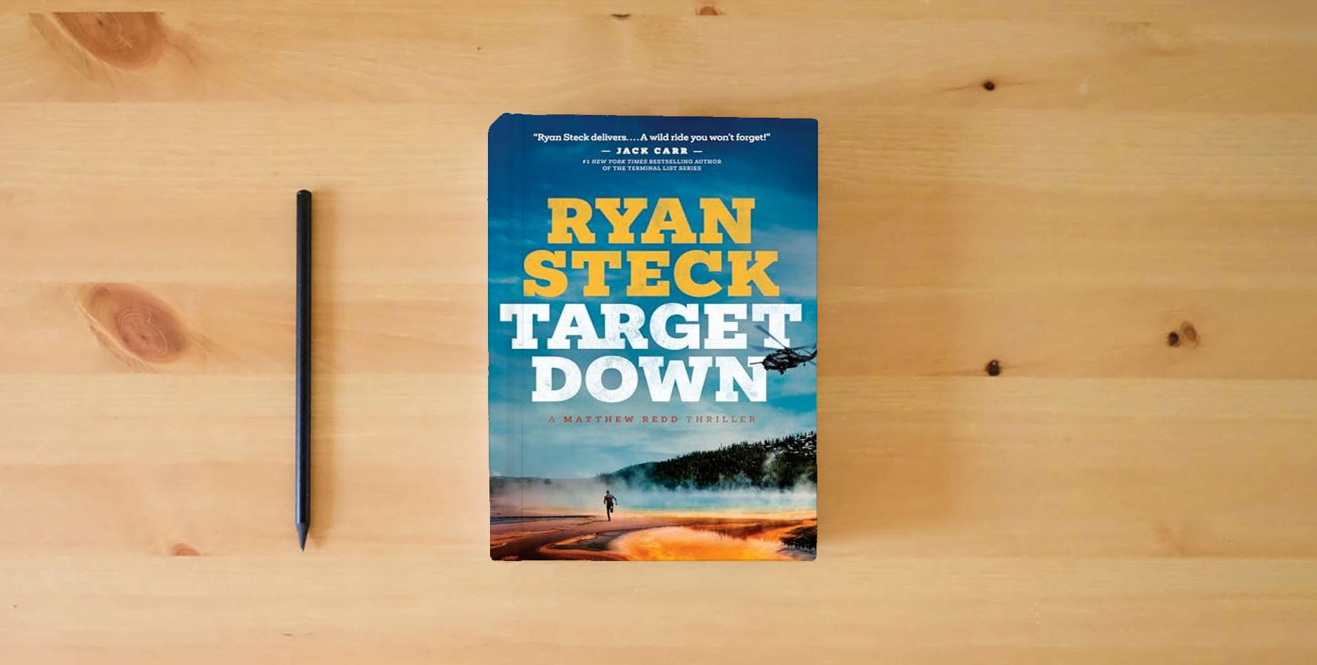 The book Target Down (A Matthew Redd Thriller) is on the table