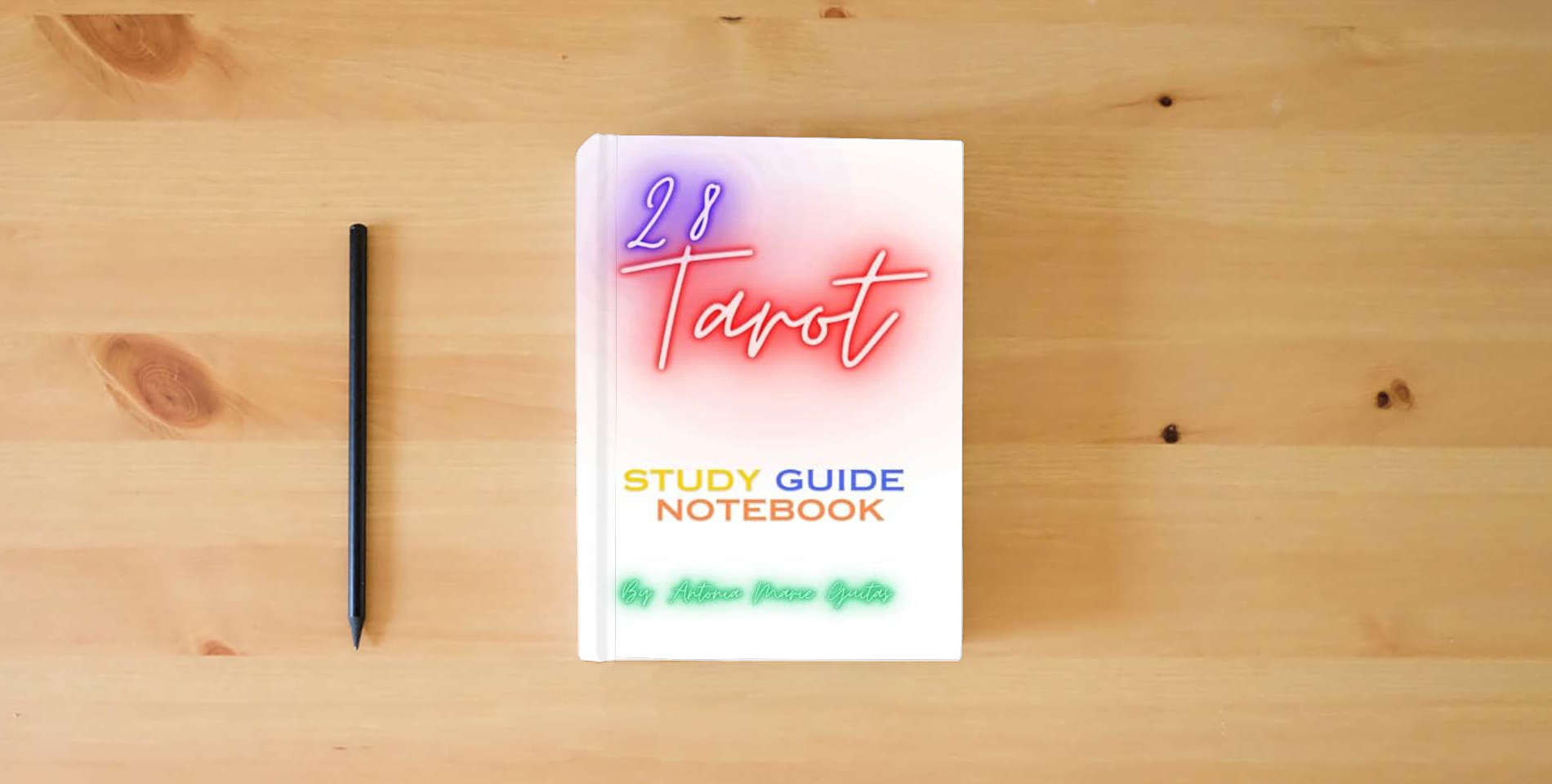 The book Tarot: 28 Tarot Study Guide NoteBook is on the table