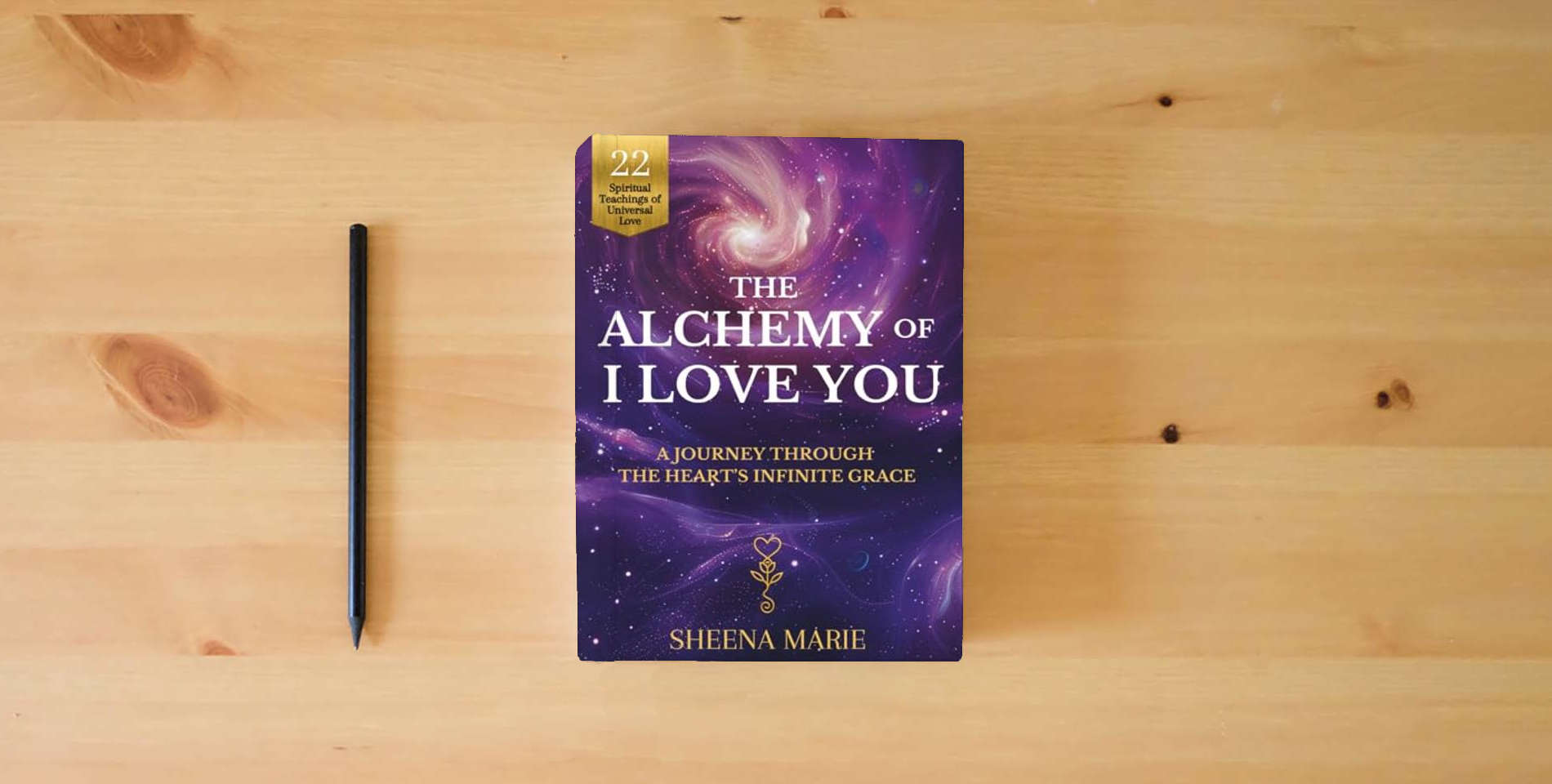 The book The Alchemy of I Love You: A Journey Through The Heart's Infinite Grace is on the table