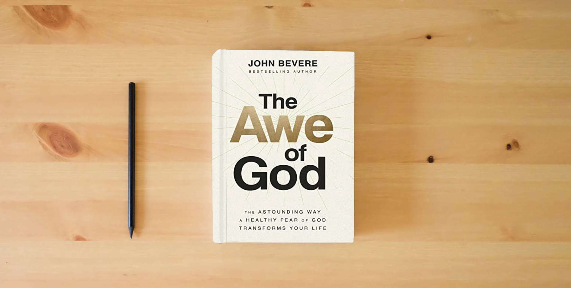 The book The Awe of God: The Astounding Way a Healthy Fear of God Transforms Your Life is on the table
