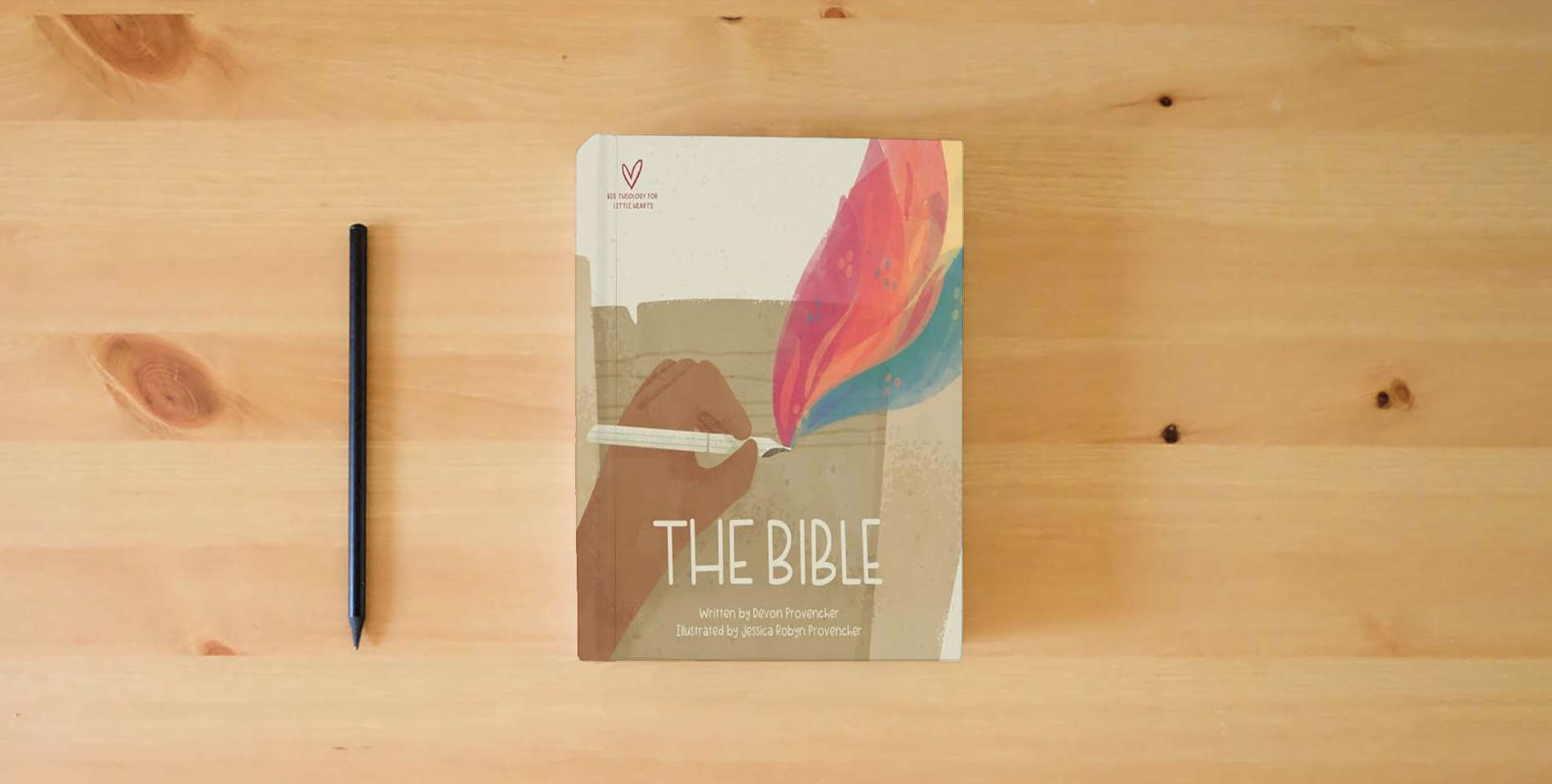 The book The Bible (Big Theology for Little Hearts) is on the table