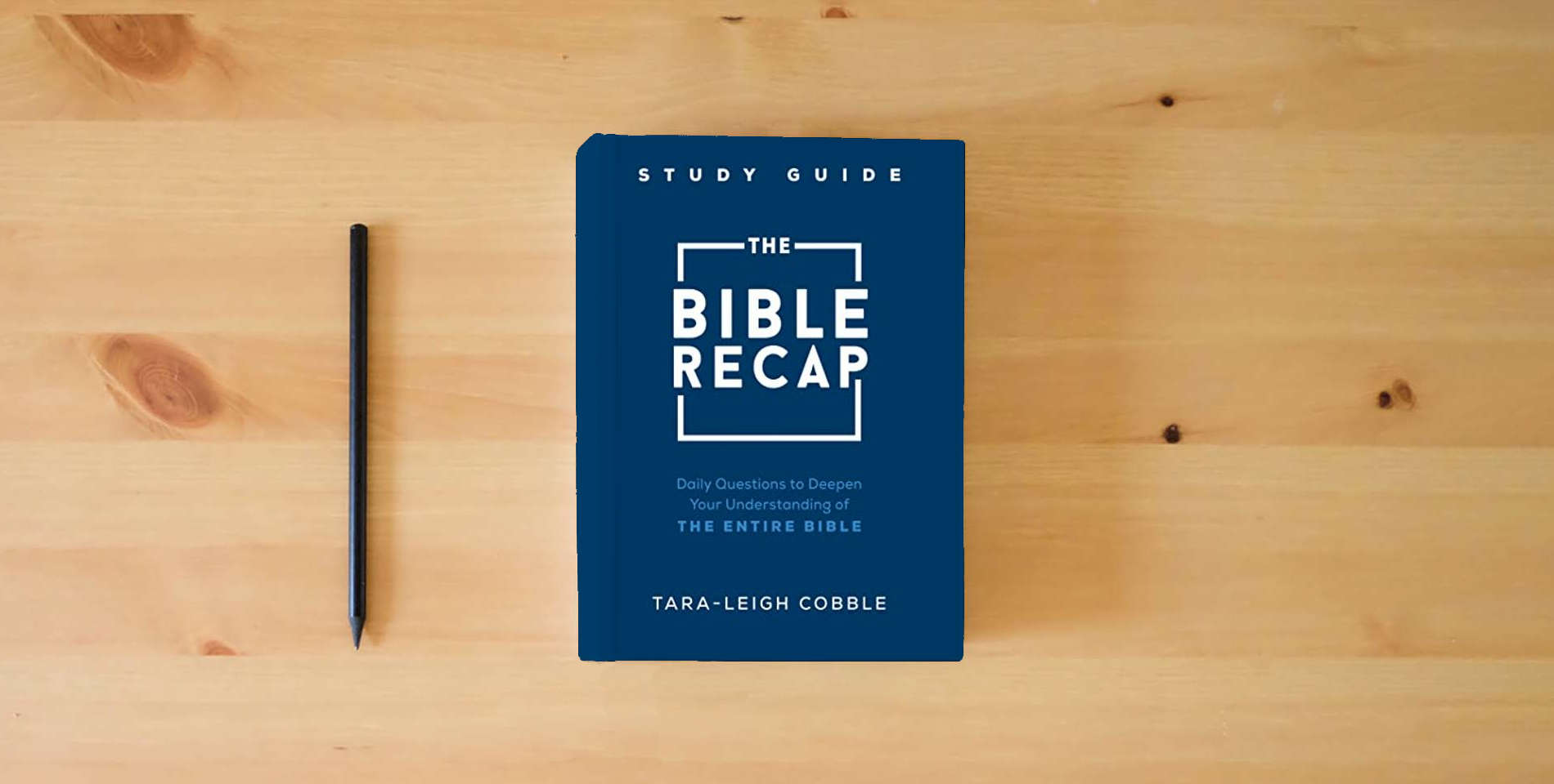 The book The Bible Recap Study Guide: Daily Questions to Deepen Your Understanding of the Entire Bible is on the table
