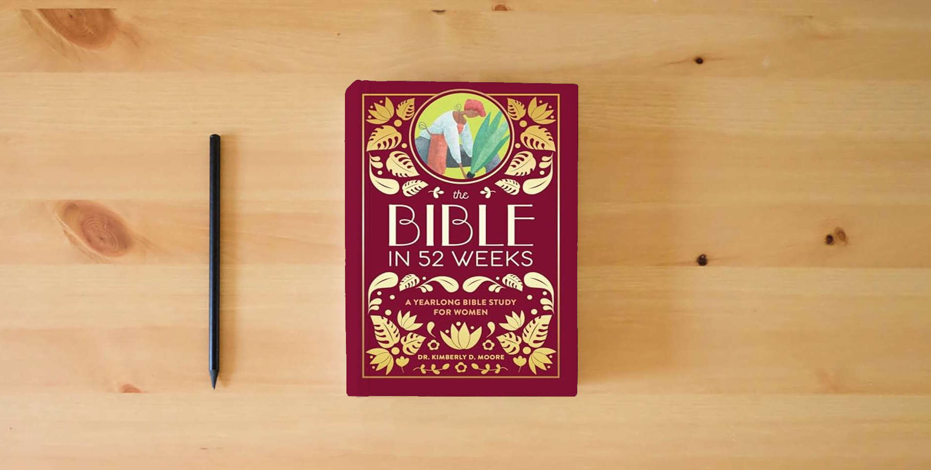 The book The Bible in 52 Weeks (Deluxe Edition): A Yearlong Bible Study for Women is on the table
