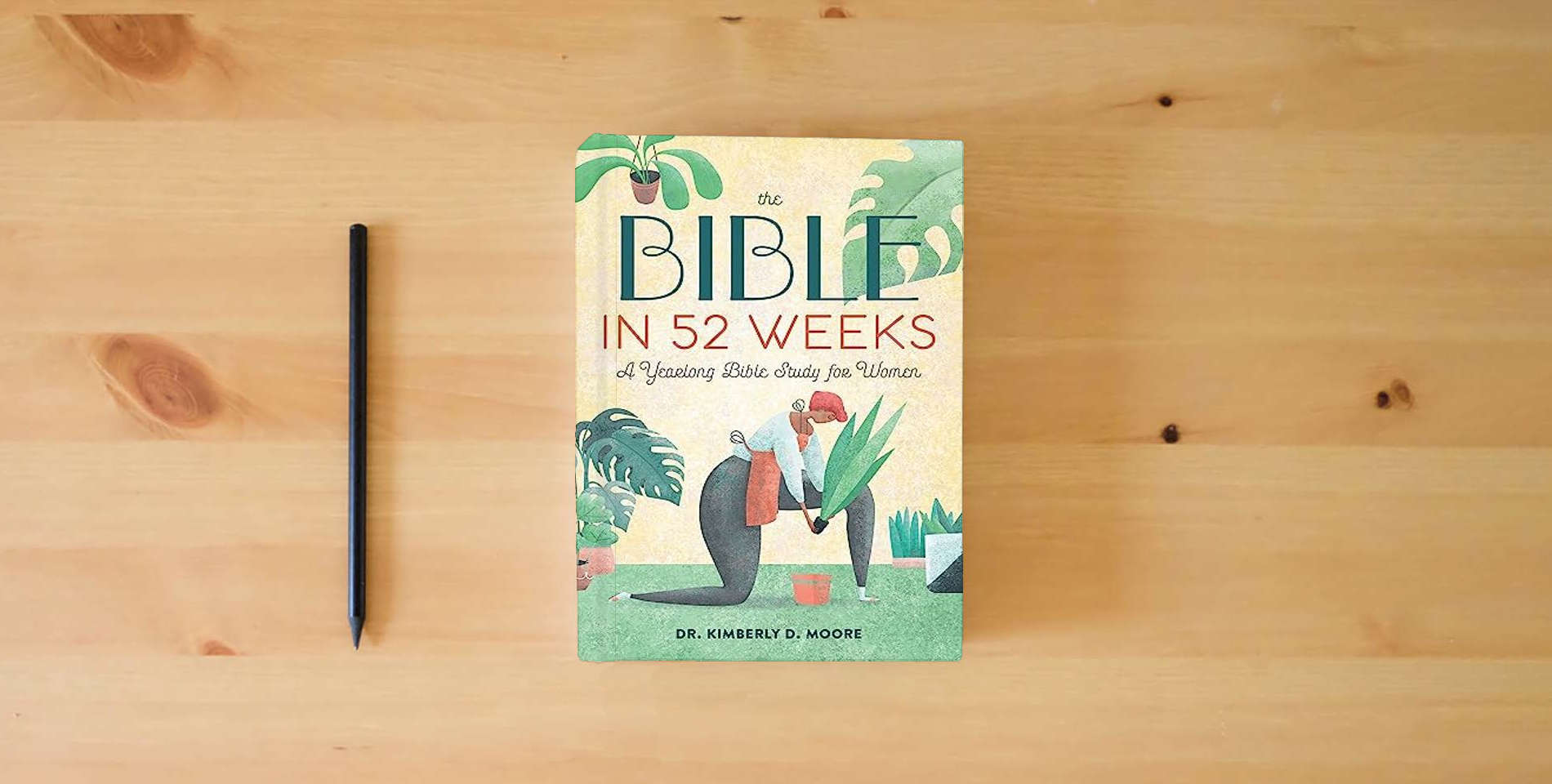 The book The Bible in 52 Weeks: A Yearlong Bible Study for Women is on the table
