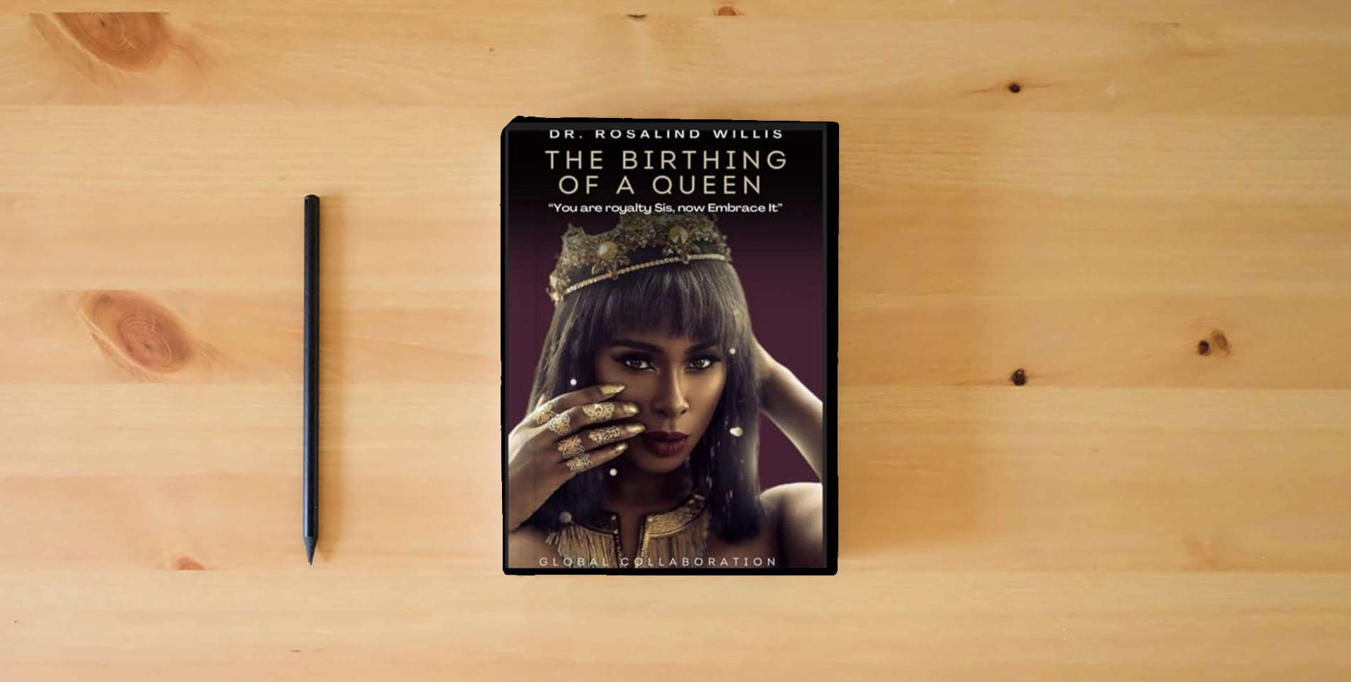 The book The Birthing of A Queen: Your Royalty Sis Embrace It! Global Collaboration is on the table