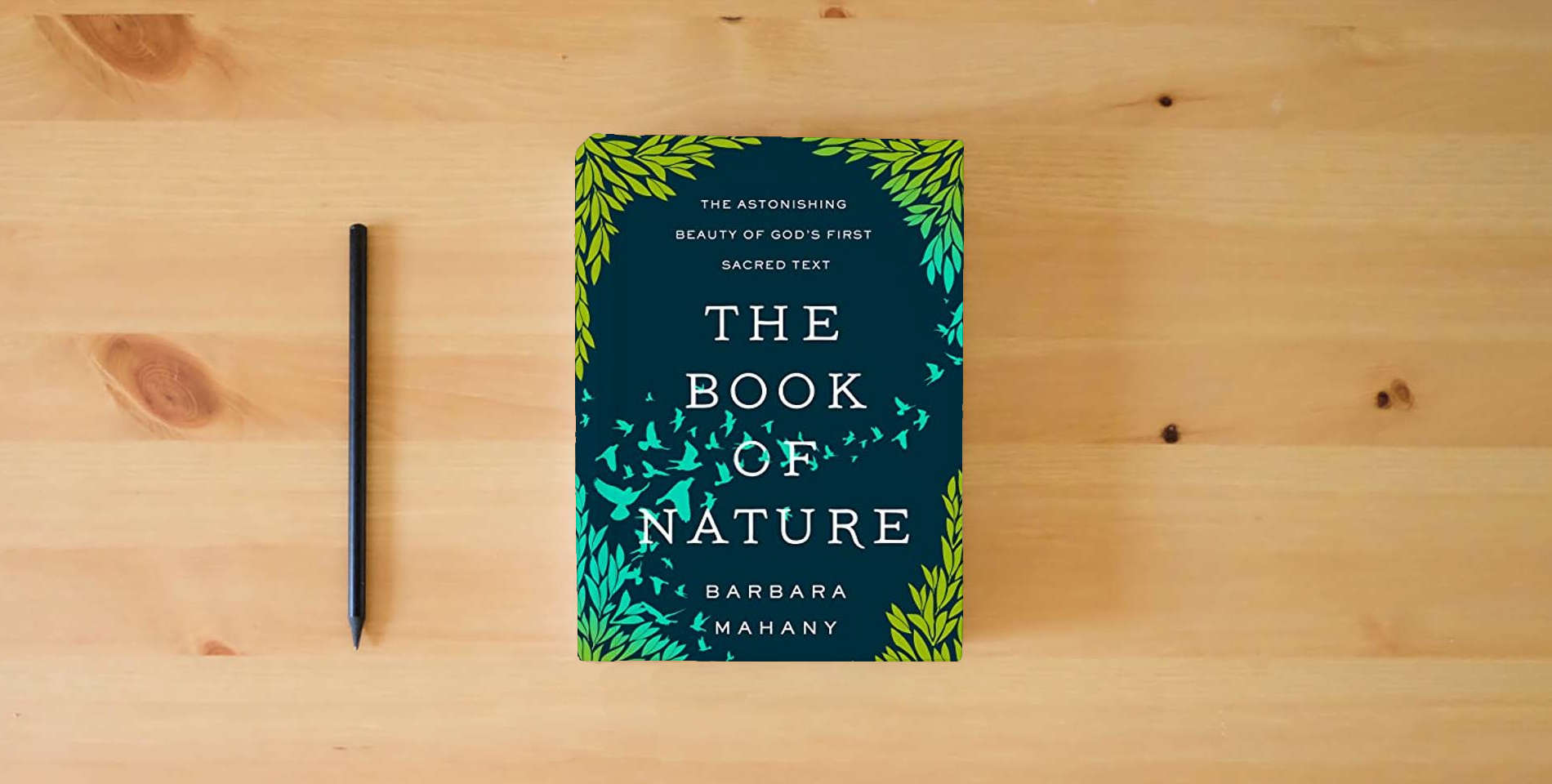 The book The Book of Nature: The Astonishing Beauty of God’s First Sacred Text is on the table