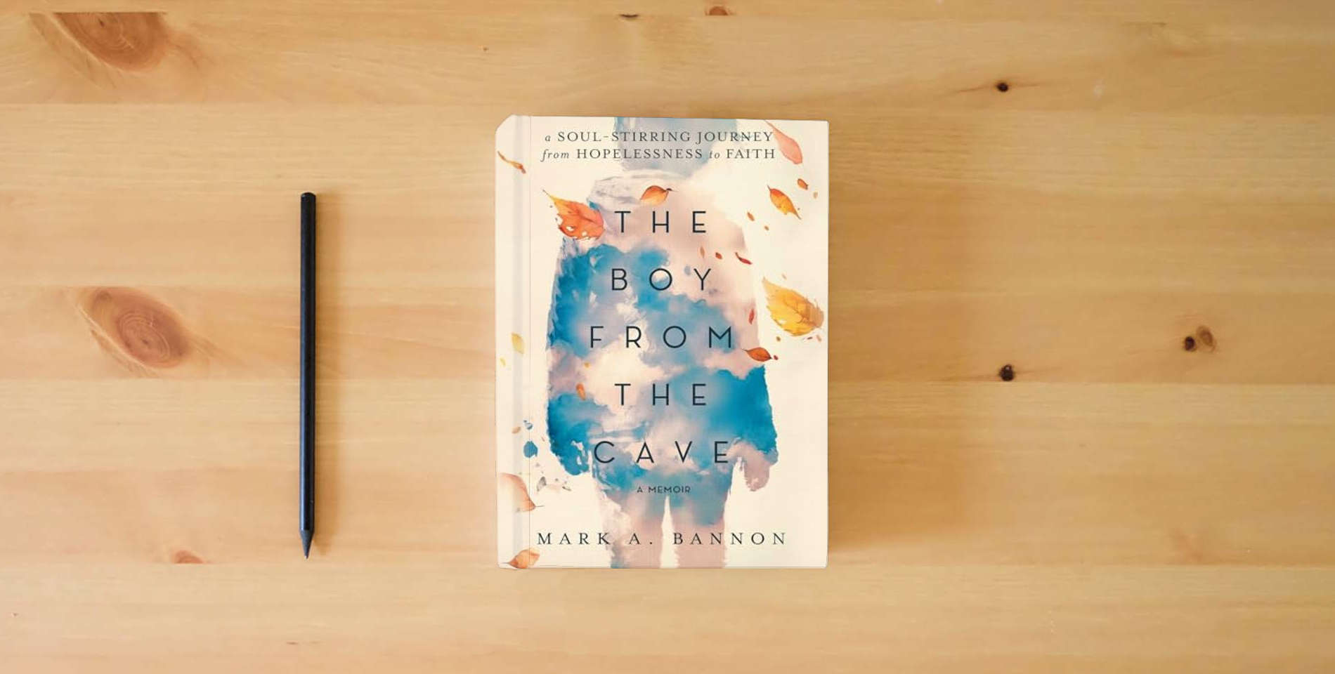 The book The Boy from the Cave: A Soul-Stirring Journey from Hopelessness to Faith is on the table