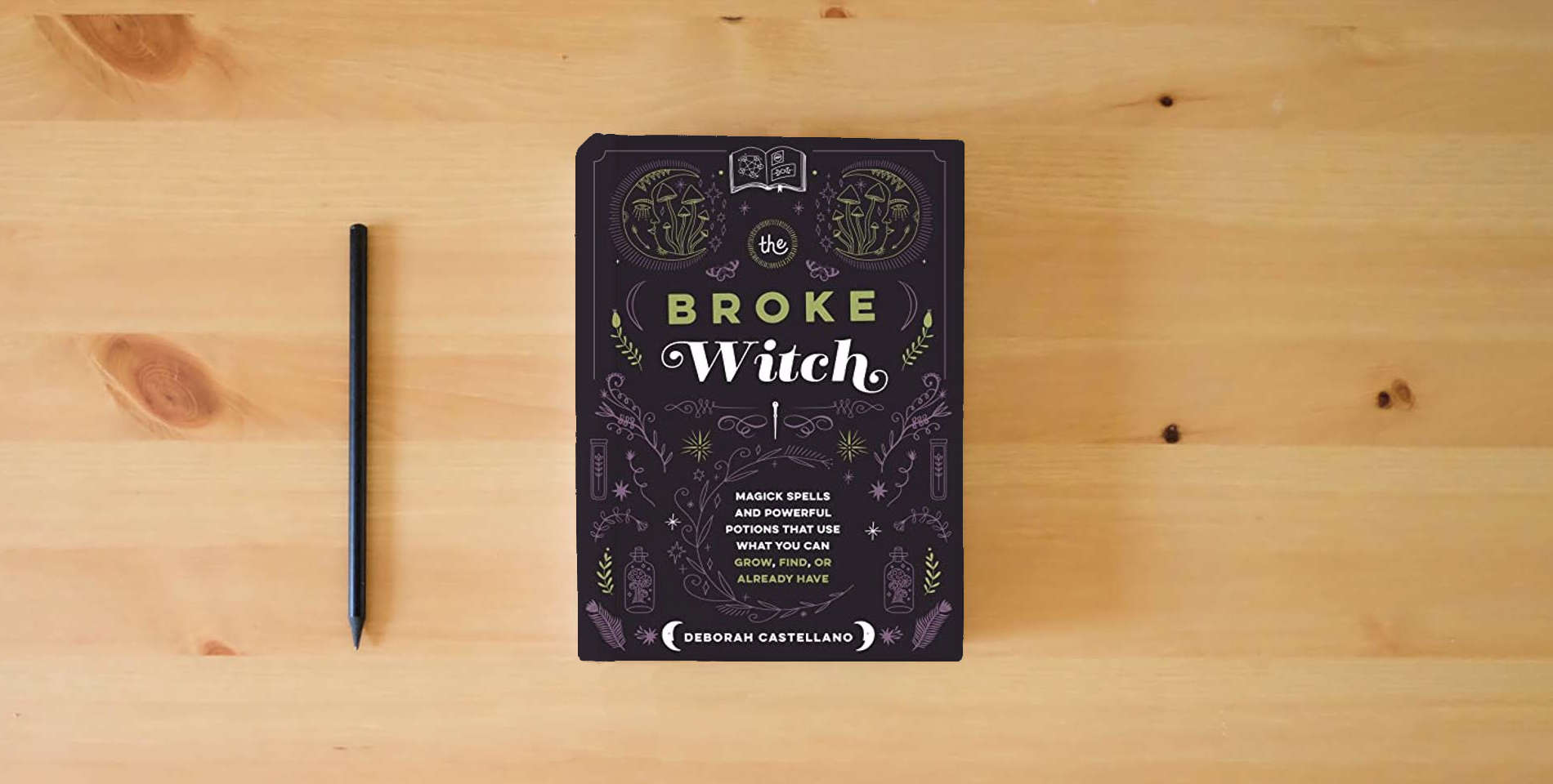 The book The Broke Witch: Magick Spells and Powerful Potions that Use What You Can Grow, Find, or Already Have is on the table