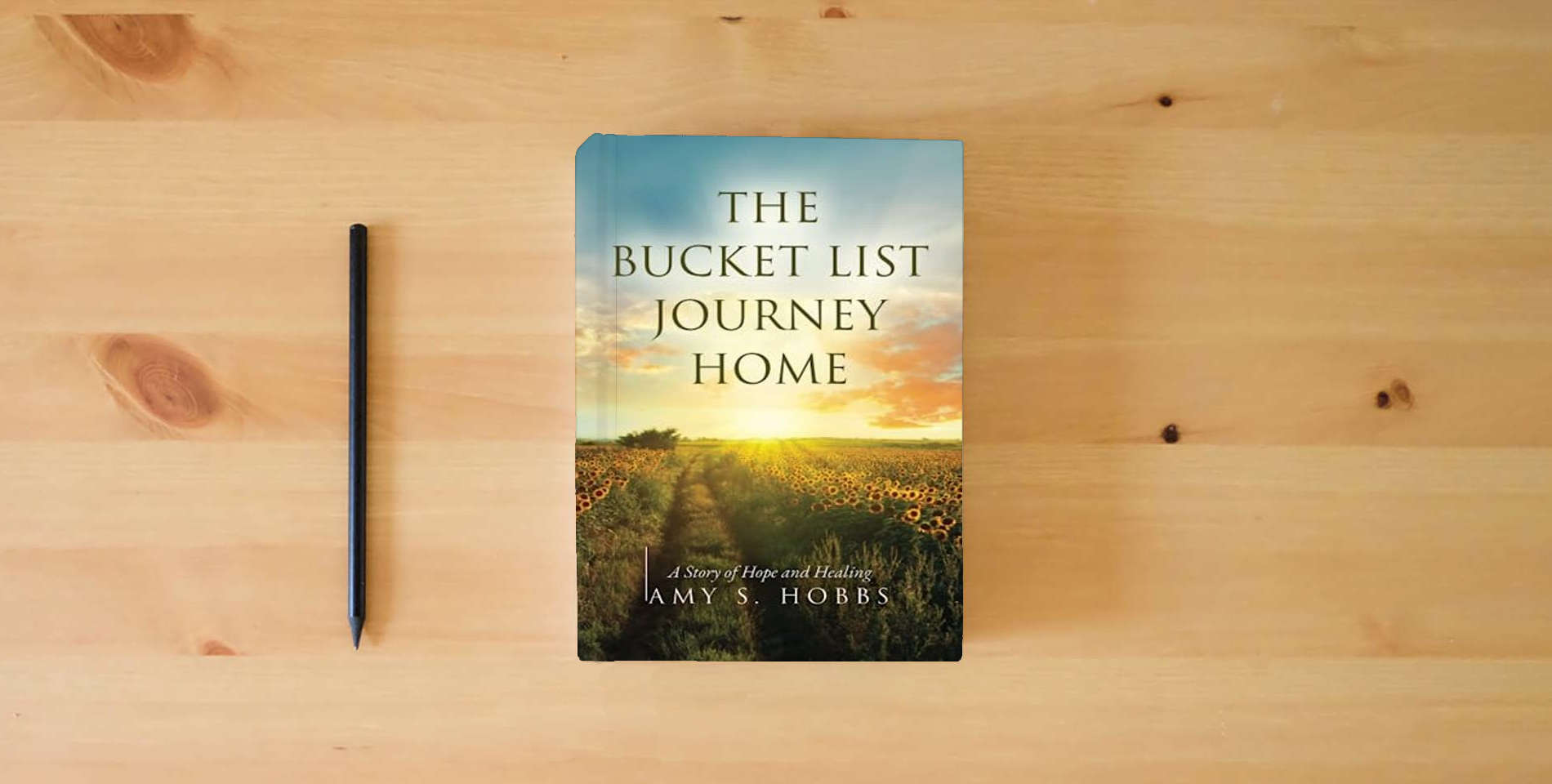 The book The Bucket List Journey Home: A Story of Hope and Healing is on the table