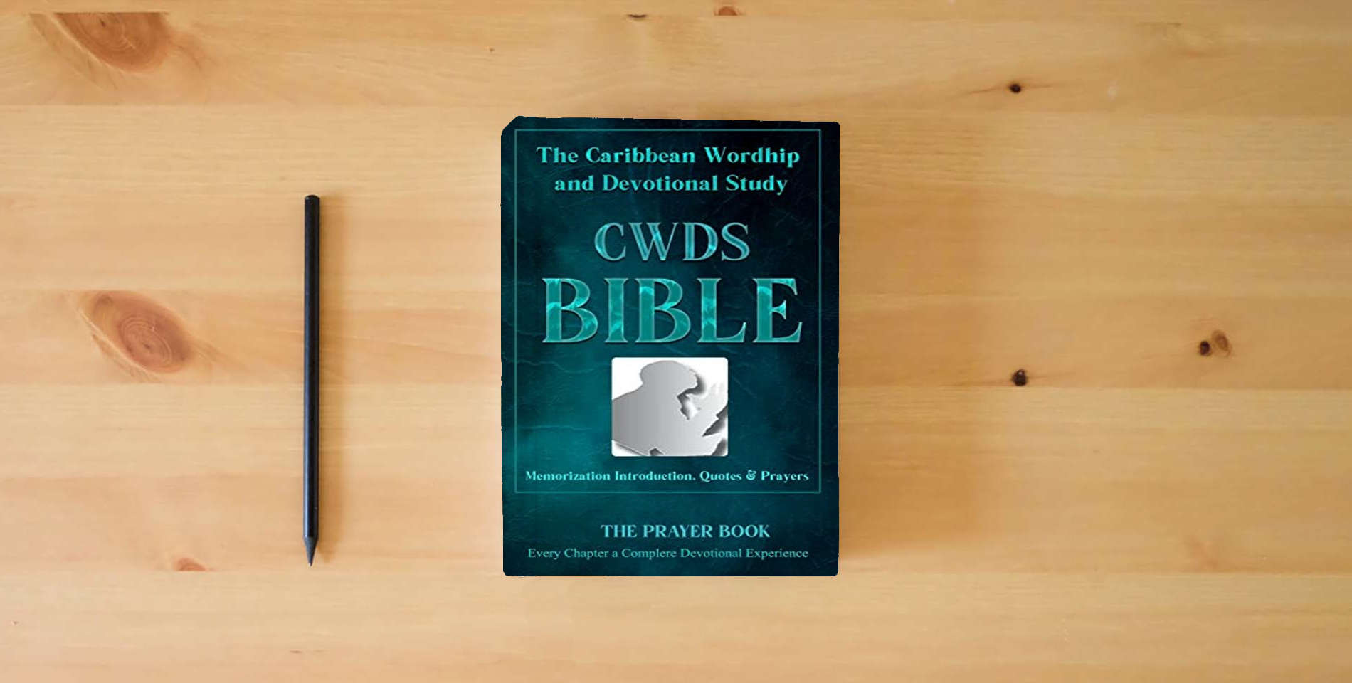 The book The Caribbean Worship and Devotional Study (CWDS) Bible is on the table