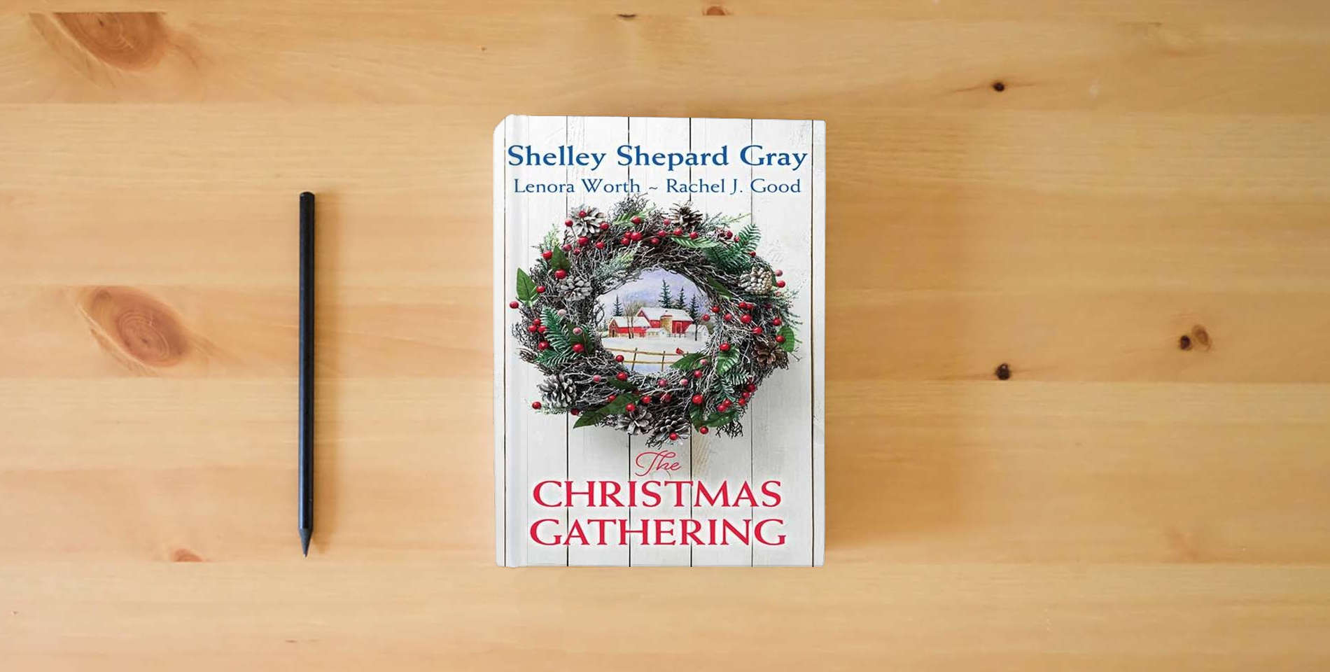 The book The Christmas Gathering (Platinum Romance Series) is on the table