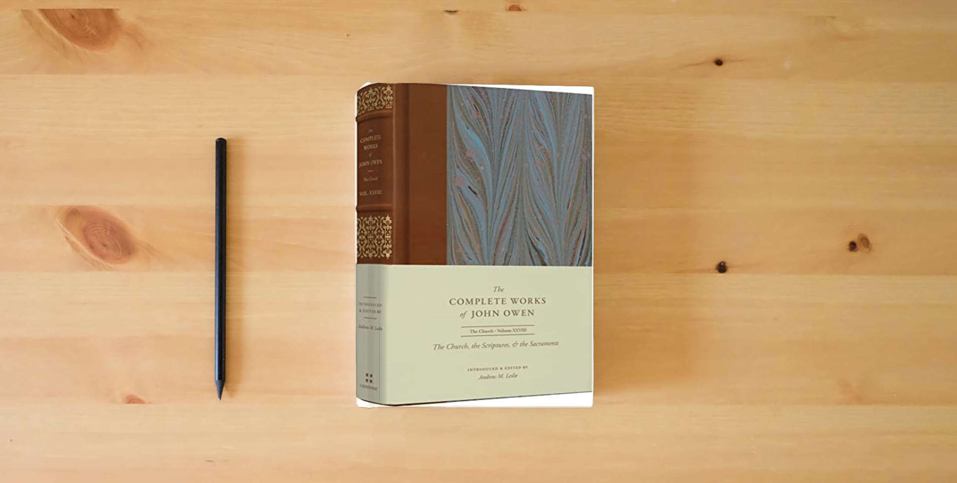 The book The Church, the Scriptures, and the Sacraments (Volume 28) (The Complete Works of John Owen) is on the table