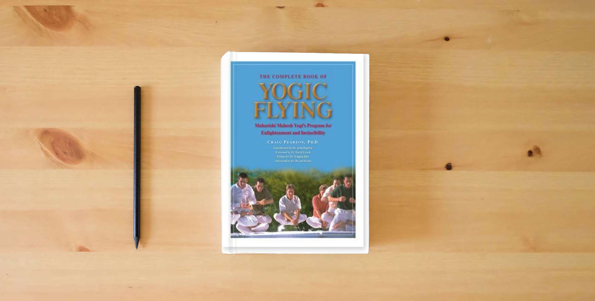 The book The Complete Book of Yogic Flying is on the table
