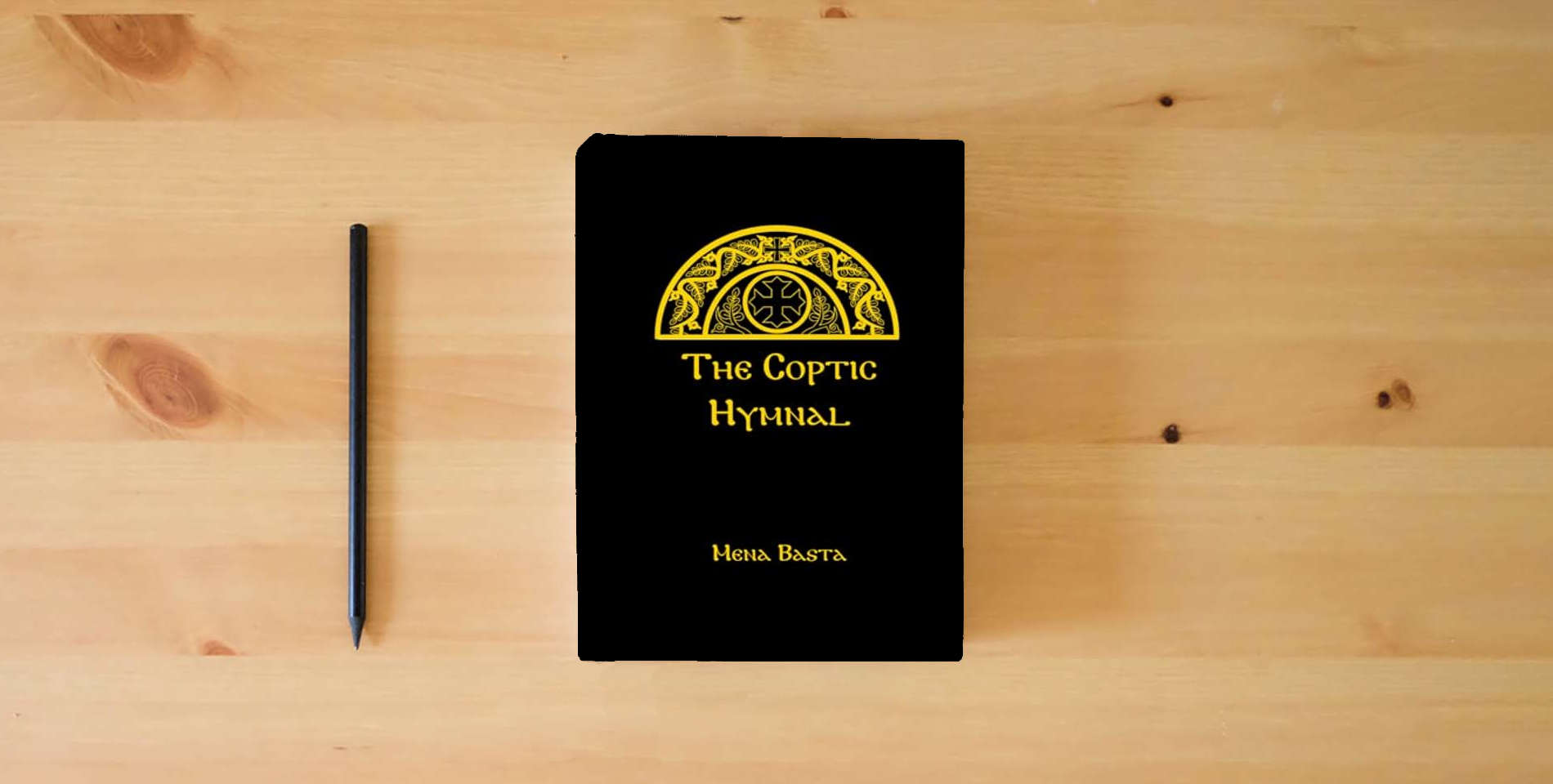 The book The Coptic Hymnal is on the table