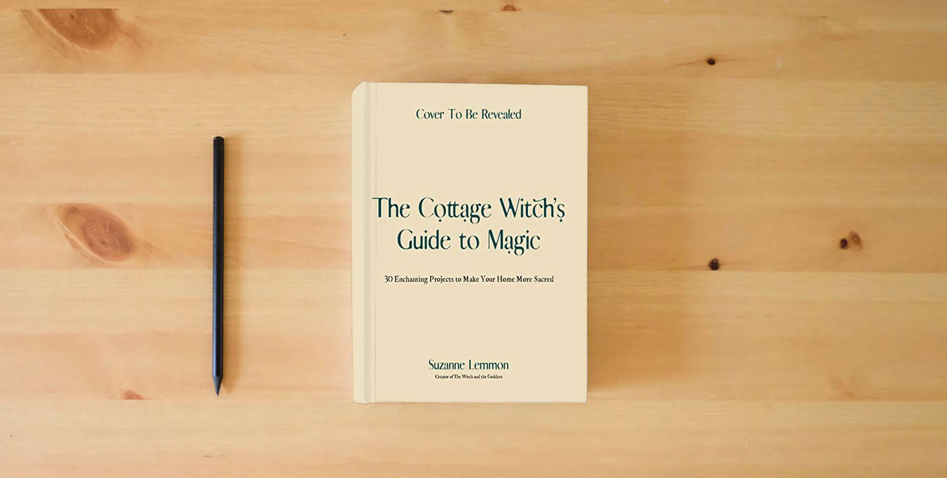 The book The Cottage Witch's Guide to Magic: 30 Enchanting Projects to Make Your Home More Sacred is on the table
