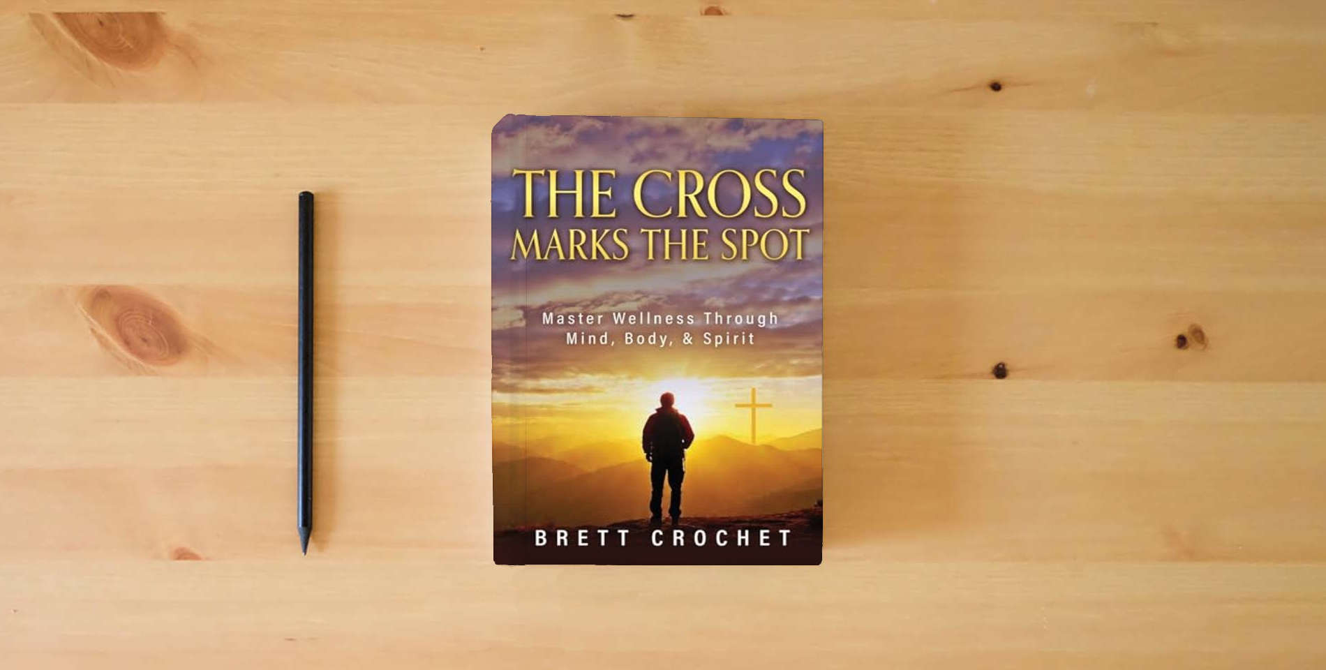 The book The Cross Marks The Spot is on the table
