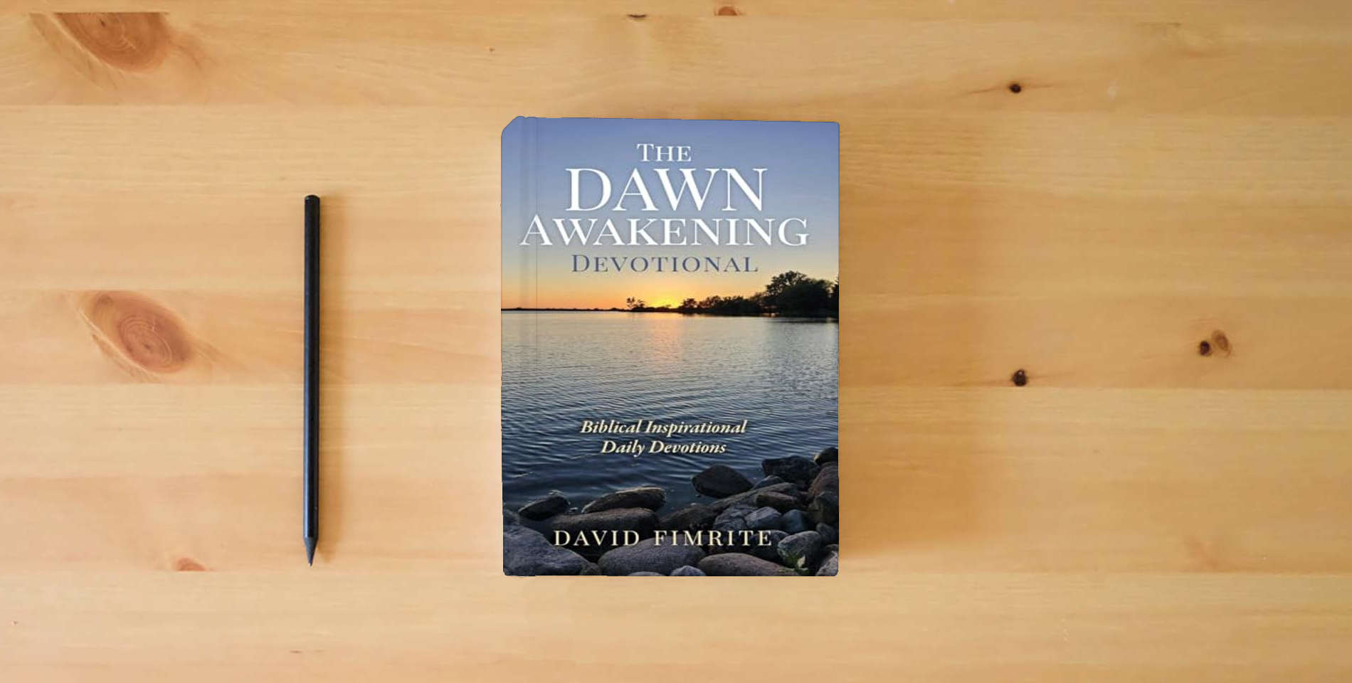 The book The Dawn Awakening Devotional is on the table