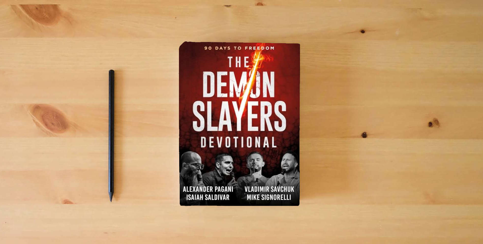 The book The Demon Slayers Devotional: 90 Days to Freedom is on the table