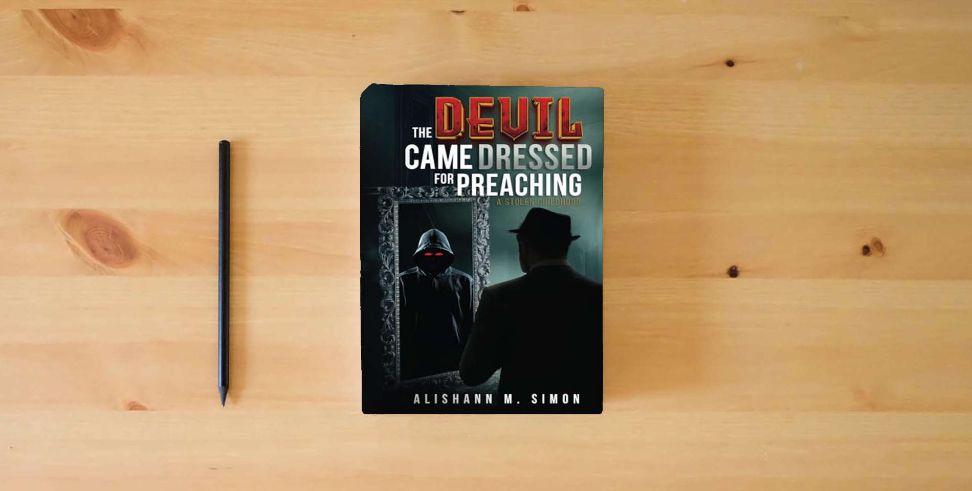 The book The Devil Came Dressed for Preaching: A Stolen Childhood is on the table