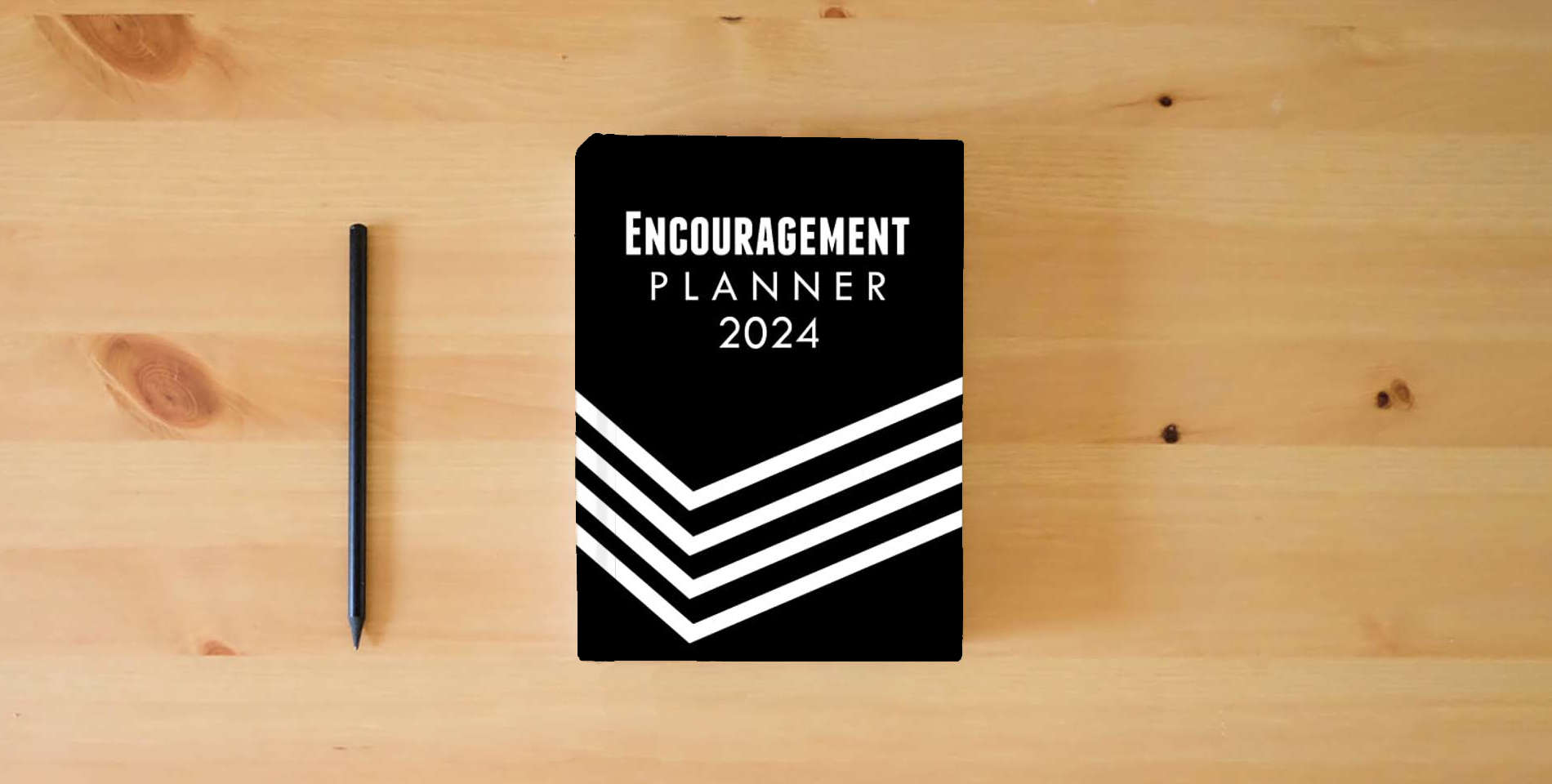 The book The Encouragement Planner: 2024 is on the table