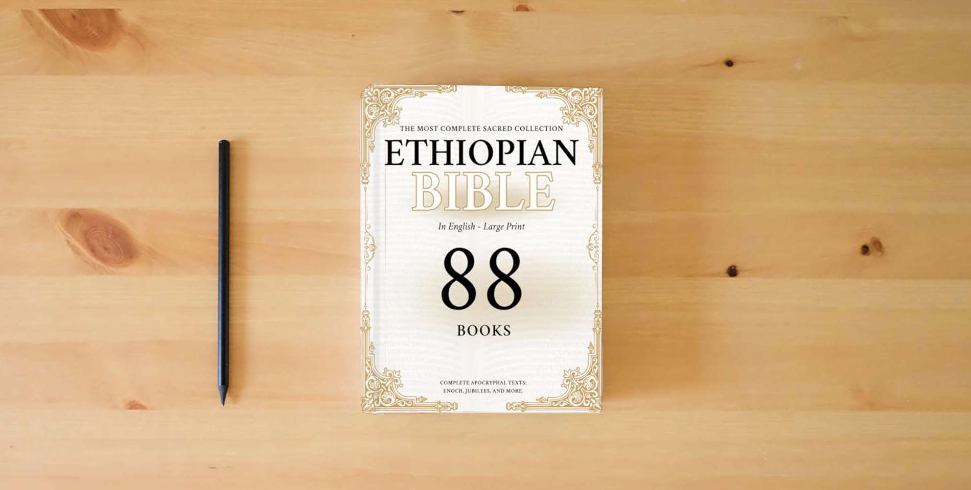 The book The Ethiopian Bible: The Most Complete Sacred Collection – Including the Lost Apocrypha, Enoch, and the Hidden Scriptures is on the table