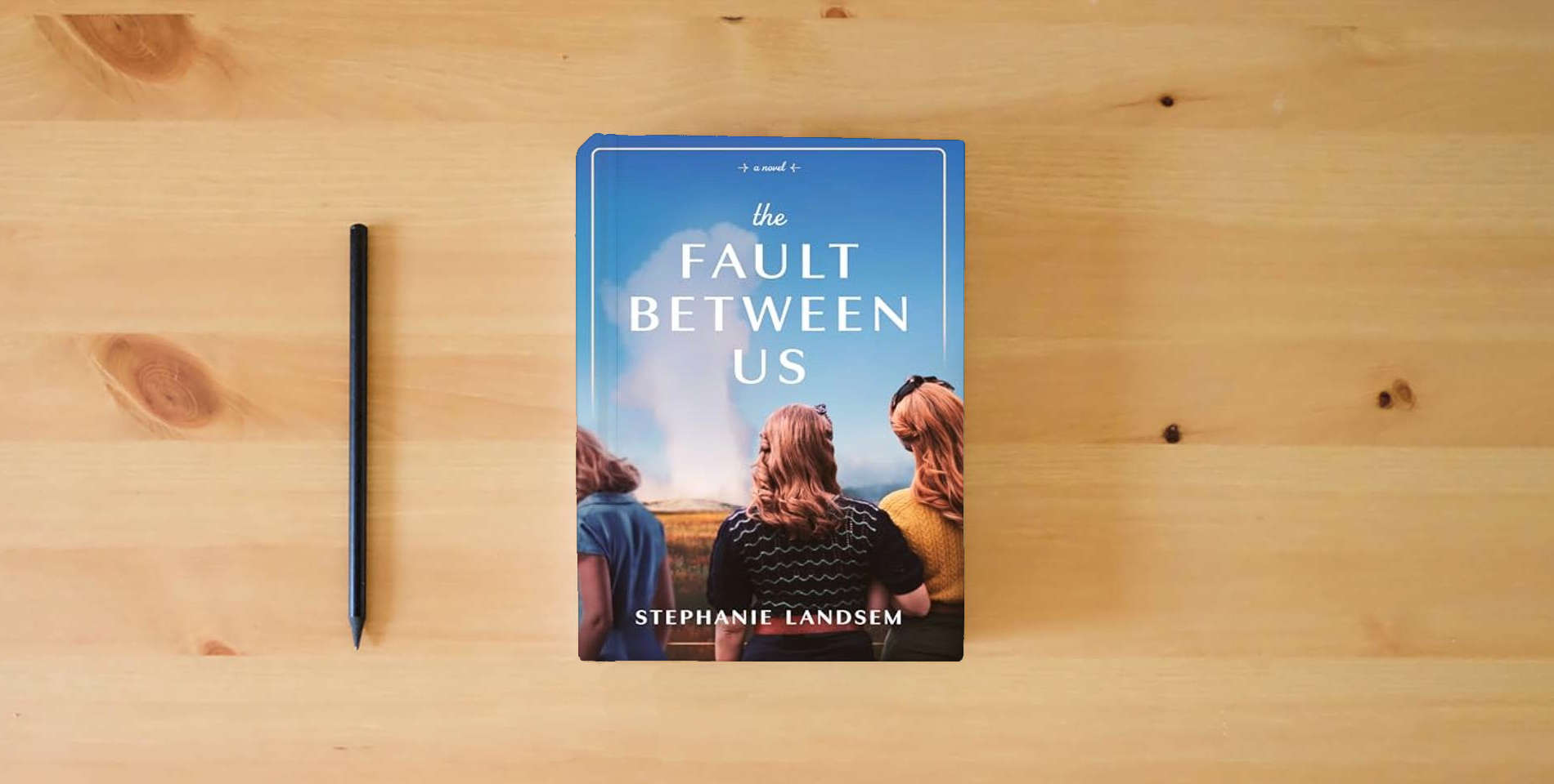 The book The Fault Between Us is on the table