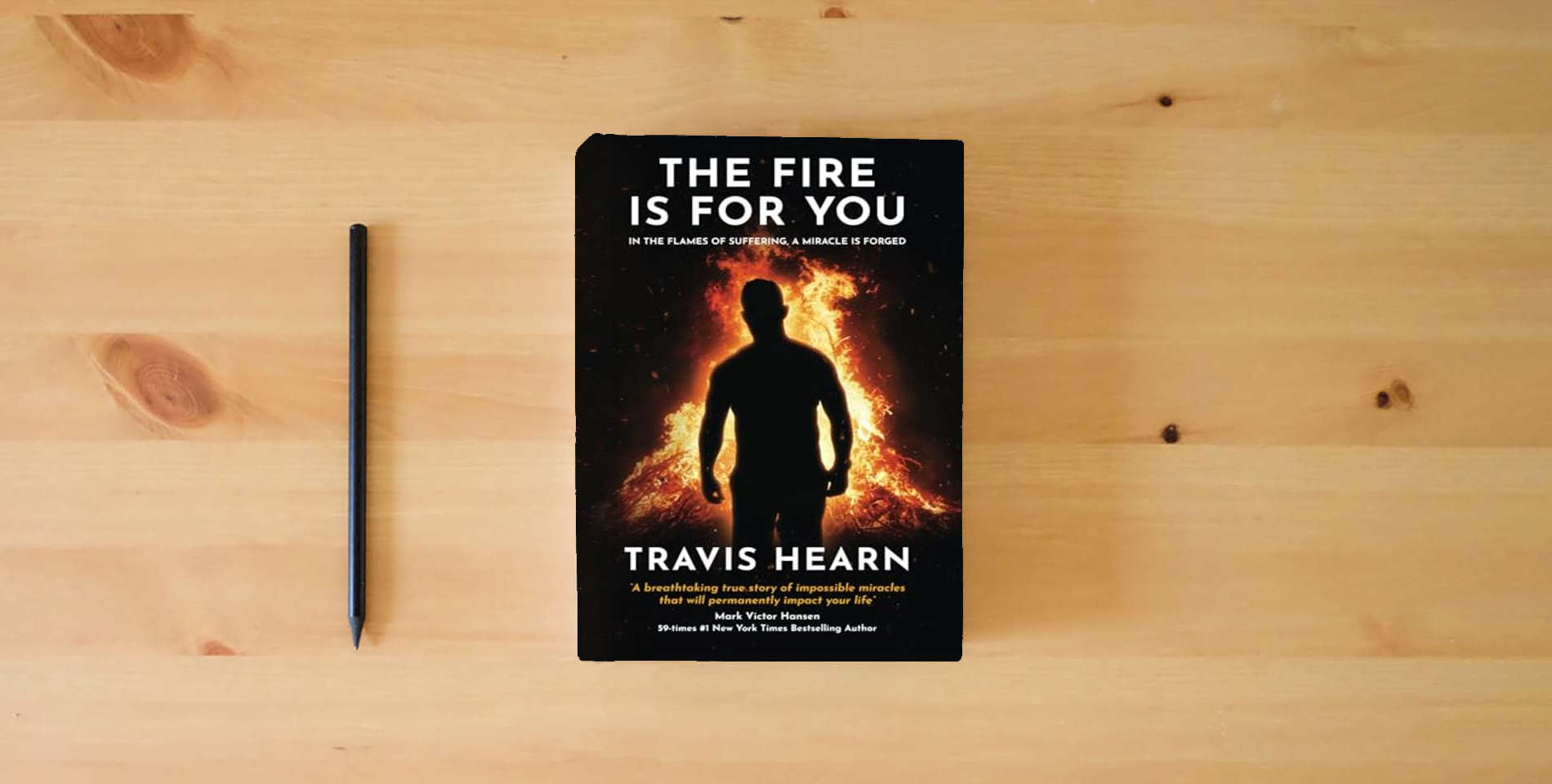 The book The Fire Is for You: In The Flames of Suffering, A Miracle Is Forged is on the table