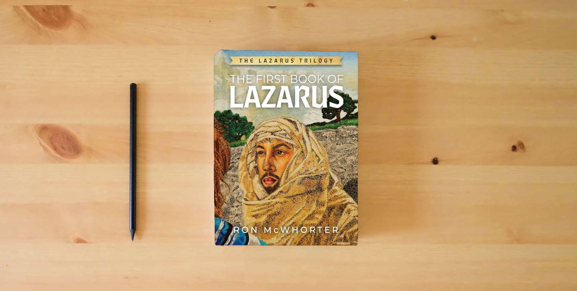 The book The First Book of Lazarus is on the table