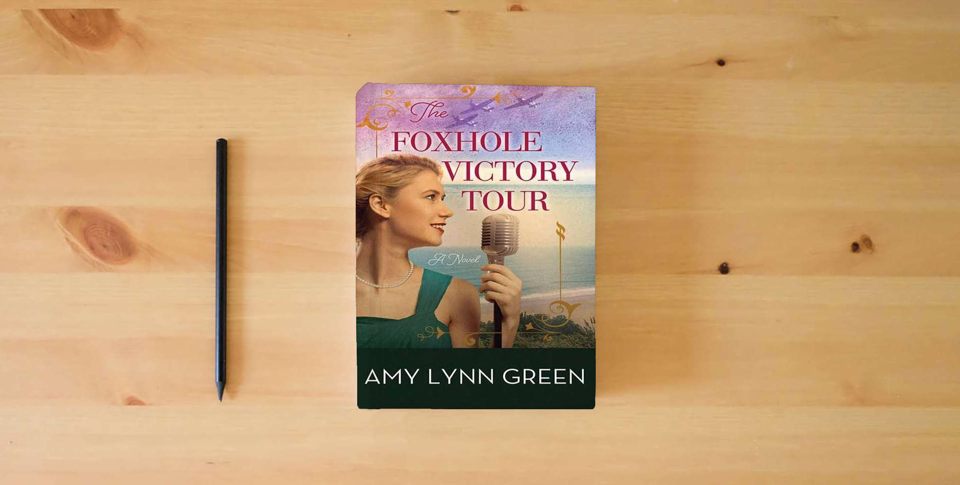 The book The Foxhole Victory Tour is on the table