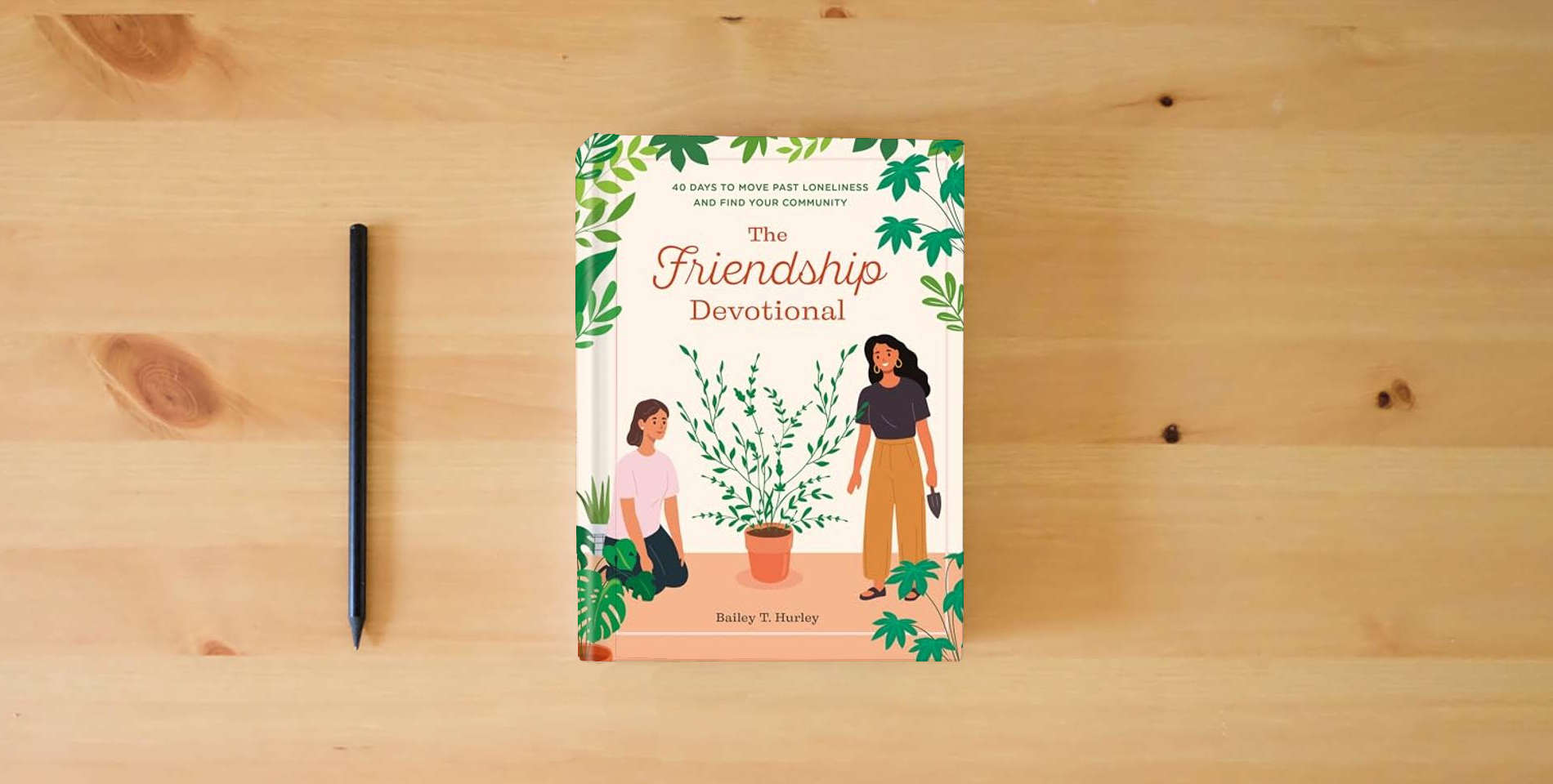 The book The Friendship Devotional: 40 Days to Move Past Loneliness and Find Your Community is on the table