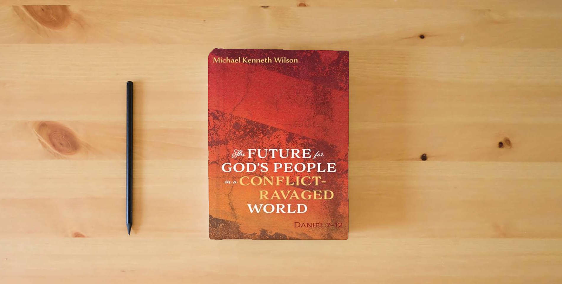 The book The Future for God's People in a Conflict-Ravaged World: Daniel 7-12 is on the table