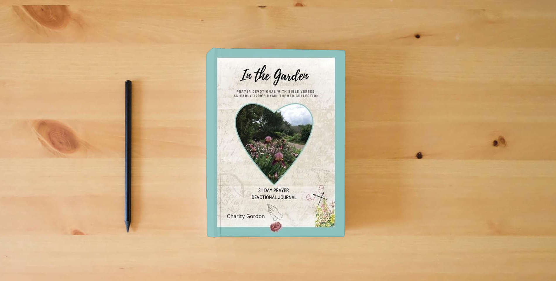 The book In the Garden: 31-Day Prayer Devotional Journal (Early 1900's Hymn Theme Collection) is on the table
