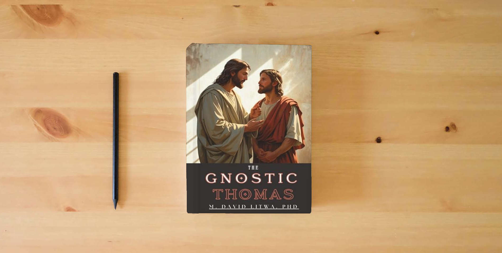 The book The Gnostic Thomas: An Introduction to the Gospel of Thomas is on the table