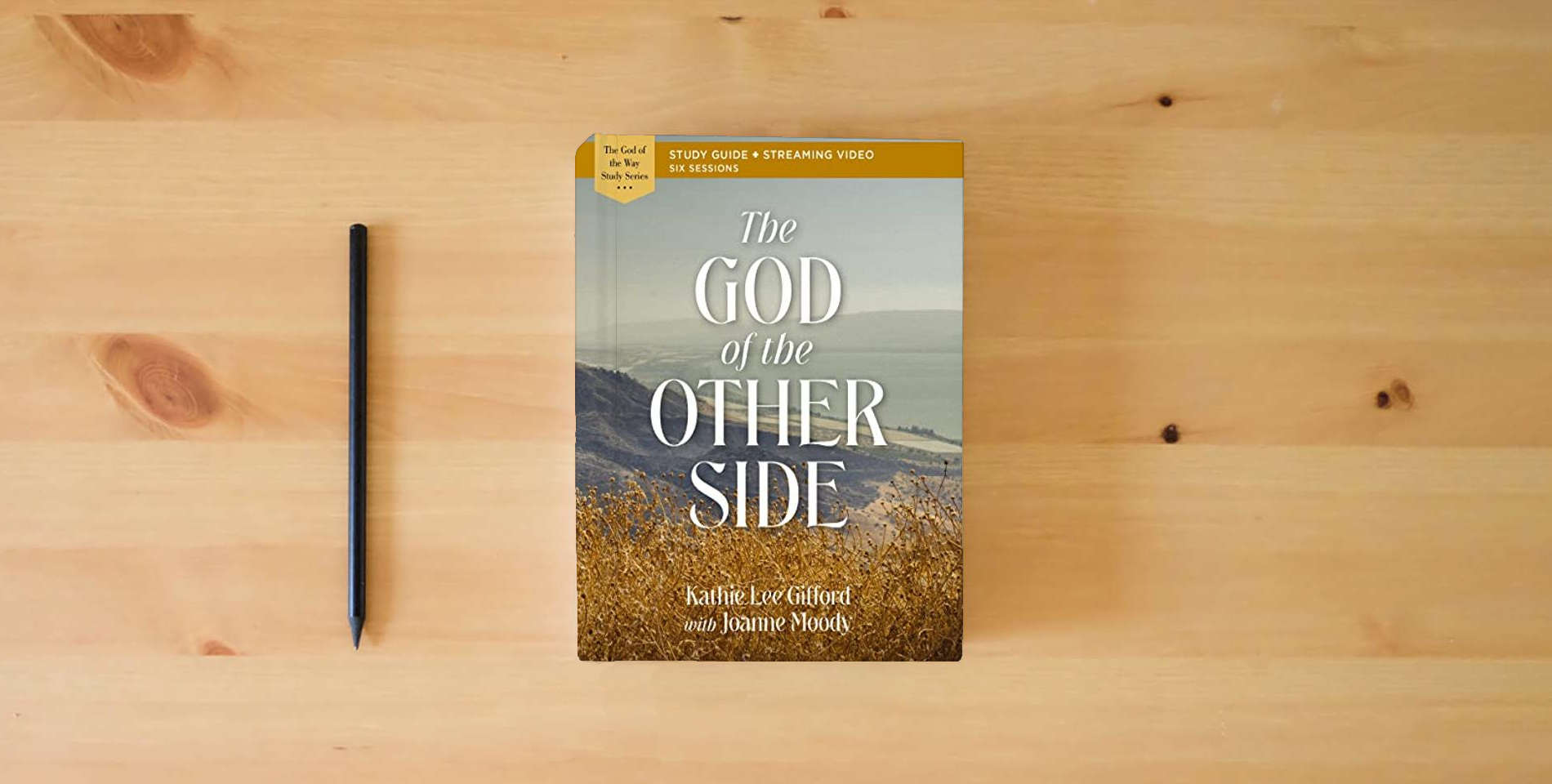The book The God of the Other Side Bible Study Guide plus Streaming Video (God of The Way) is on the table