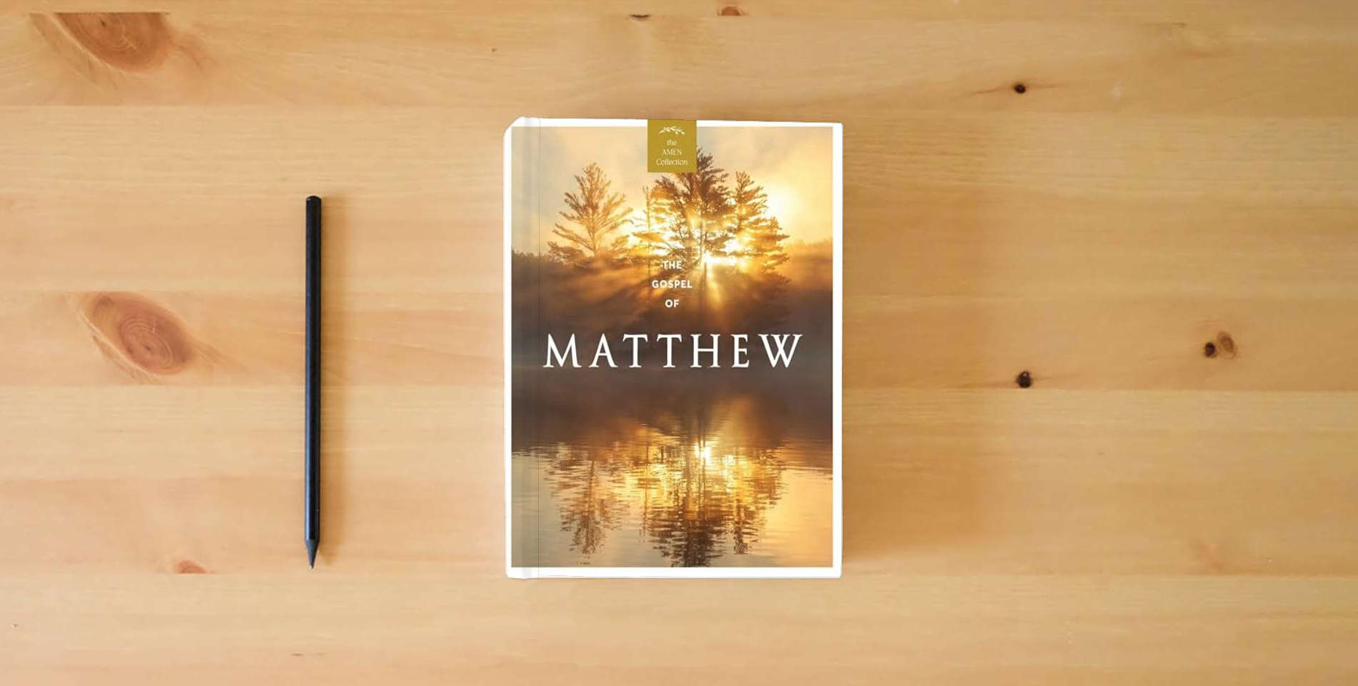 The book The Gospel of Matthew (KJV) (AMEN Collection) is on the table