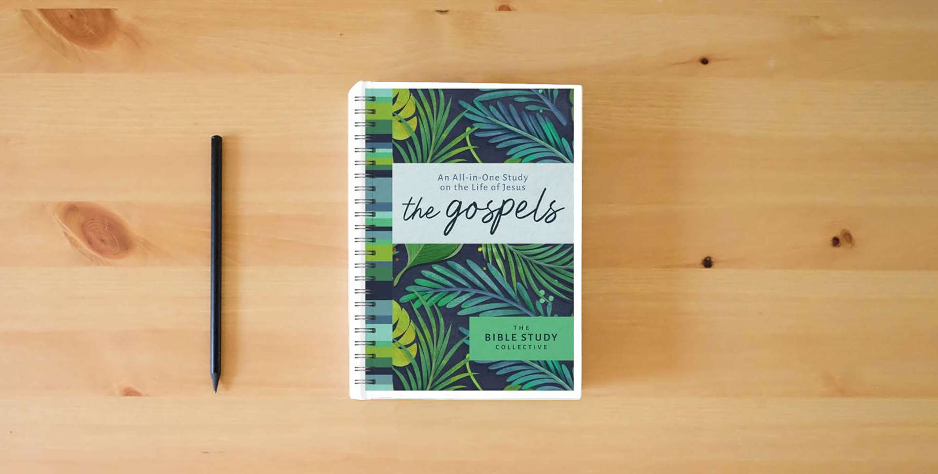 The book The Gospels: An All-In-One Study on the Life of Jesus (The Bible Study Collective) is on the table