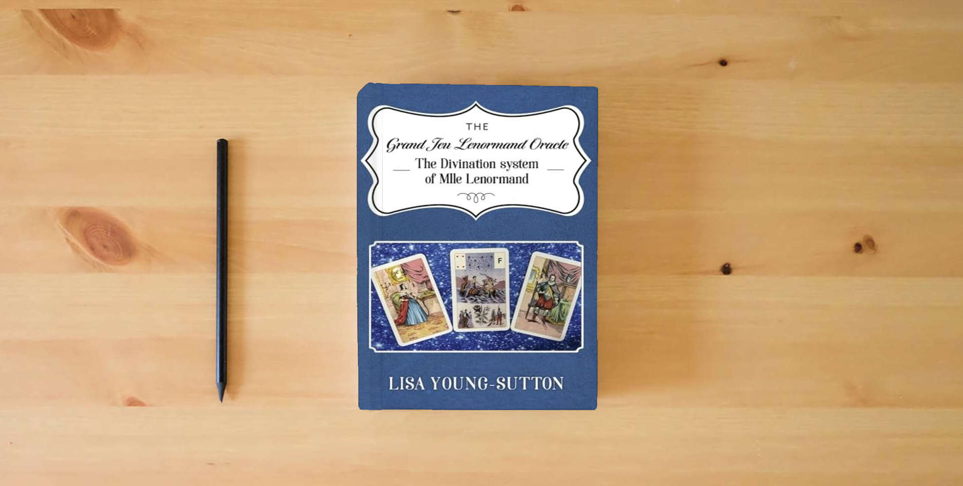 The book The Grand Jeu Lenormand Oracle: The Divination System of Mlle Lenormande is on the table