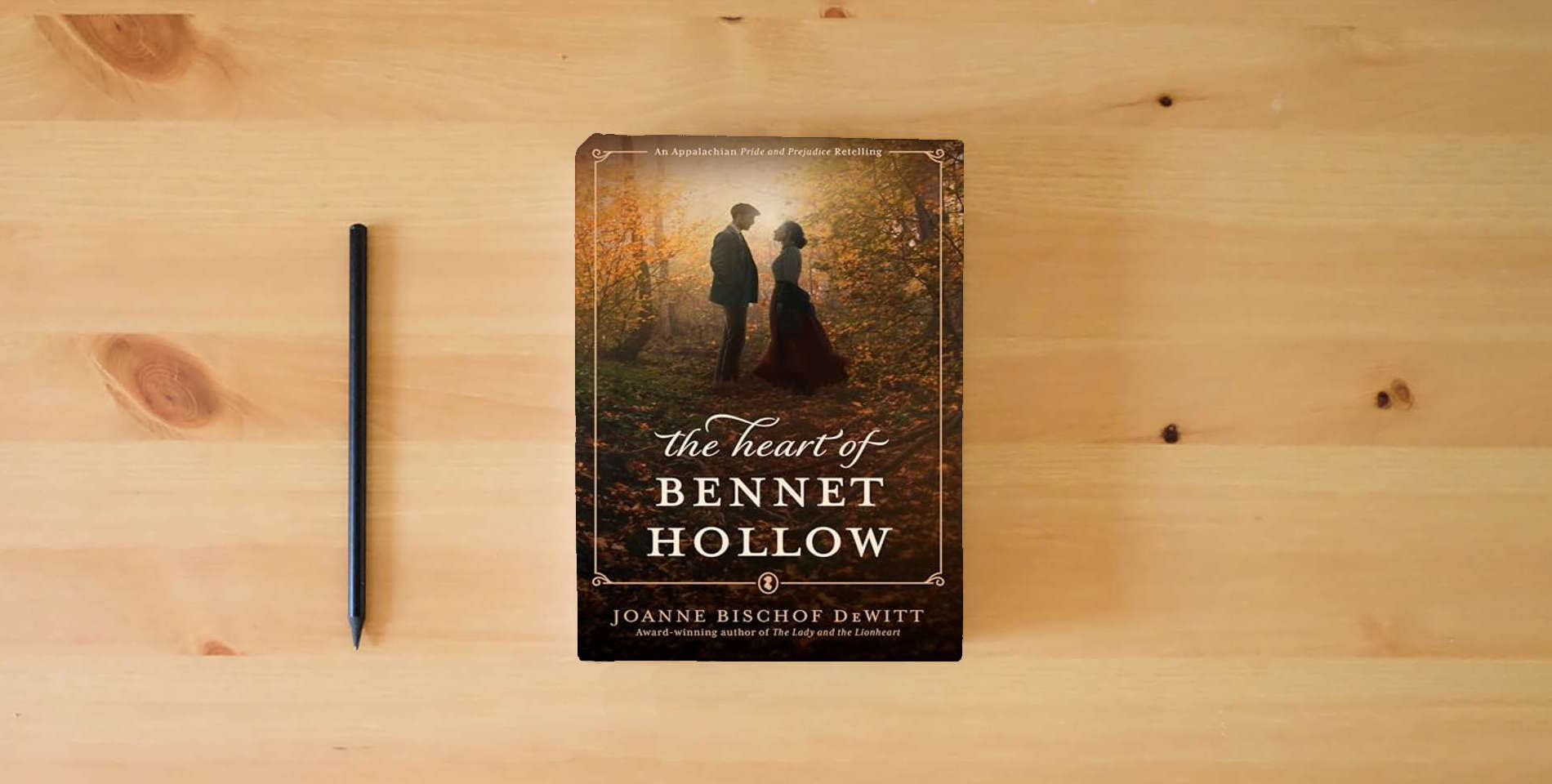 The book The Heart of Bennet Hollow is on the table