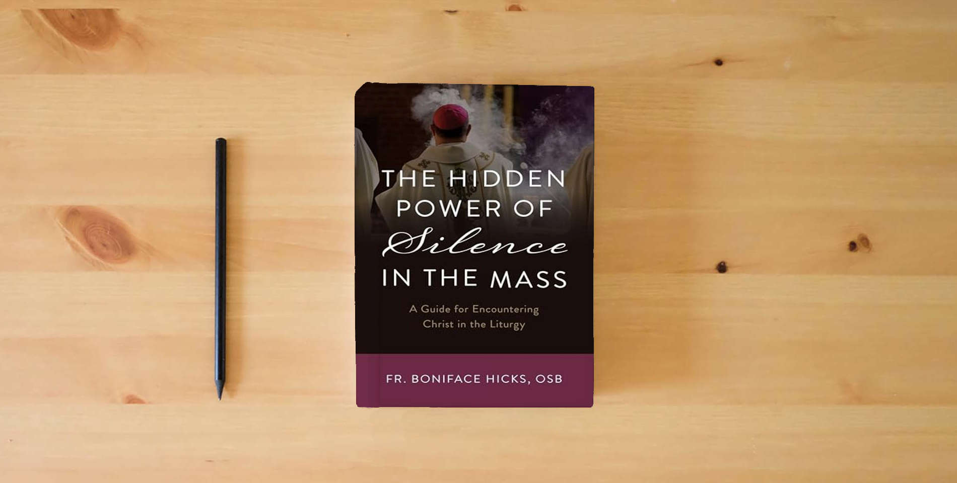 The book The Hidden Power of Silence in the Mass: A Guide for Encountering Christ in the Liturgy is on the table